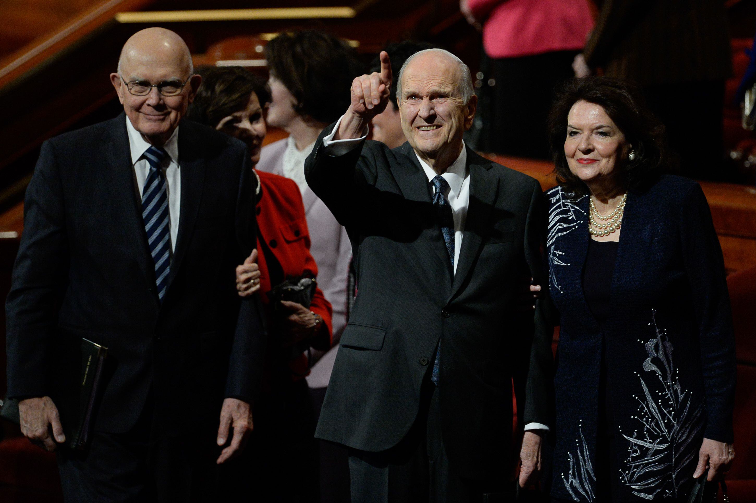 (Francisco Kjolseth | The Salt Lake Tribune) President Russell M. Nelson acknowledges the crowd as he and his wife, Sister Wendy Nelson, exit at the conclusion of the 189th twice-annual General Conference of The Church of Jesus Christ of Latter-day Saints at the Conference Center in Salt Lake City on Sunday, Oct. 6, 2019. At left is President Dallin H. Oaks, first counselor in the First Presidency of The Church of Jesus Christ of Latter-day Saints