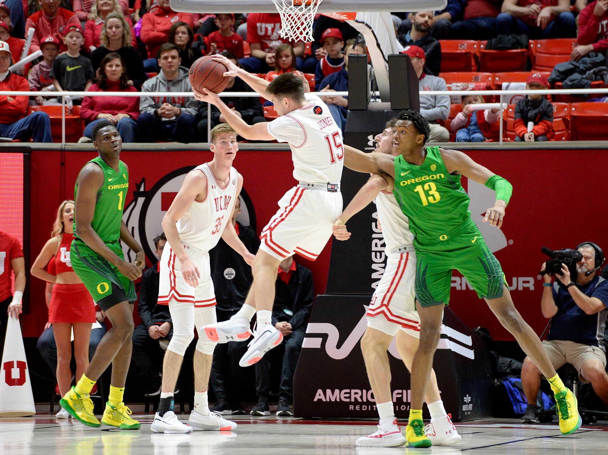 (Leah Hogsten | The Salt Lake Tribune) Utah Utes guard Rylan Jones (15) pulls down the rebound as the University of Utah basketball team hosts No. 4 Oregon, Jan. 4, 2020, at the Huntsman Center.