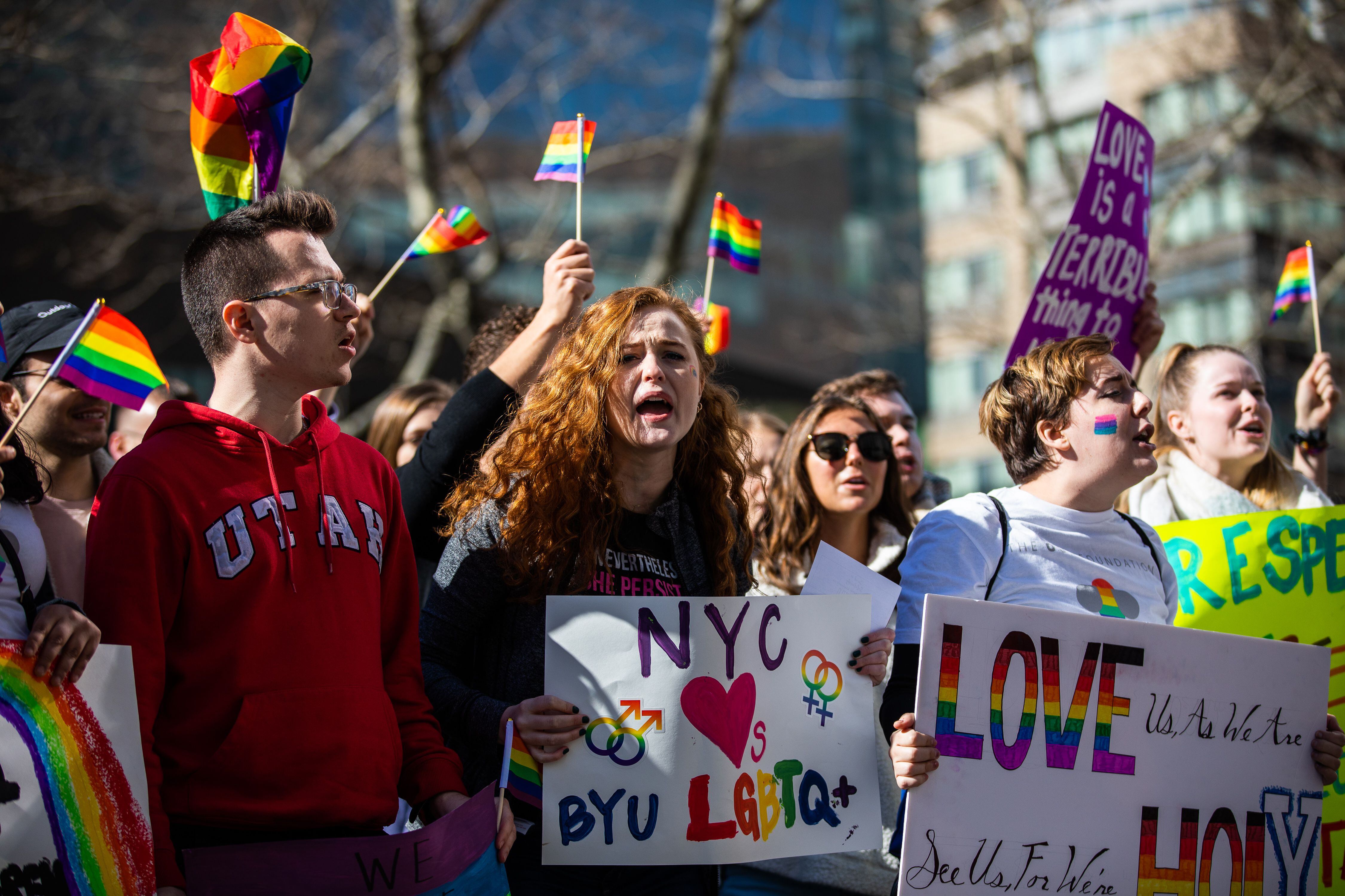 (Demetrius Freeman | for The Salt Lake Tribune) Maddie Hall, 25, center, chants with current and former members of The Church of Jesus Christ of Latter-day Saints, the LGBTQ+ community, and supporters protest at Lincoln Square across from the Latter-day Saints temple in Manhattan on Saturday, March 7, 2020. BYU reinstated policies in its student handbook that prohibit "homosexual behavior."