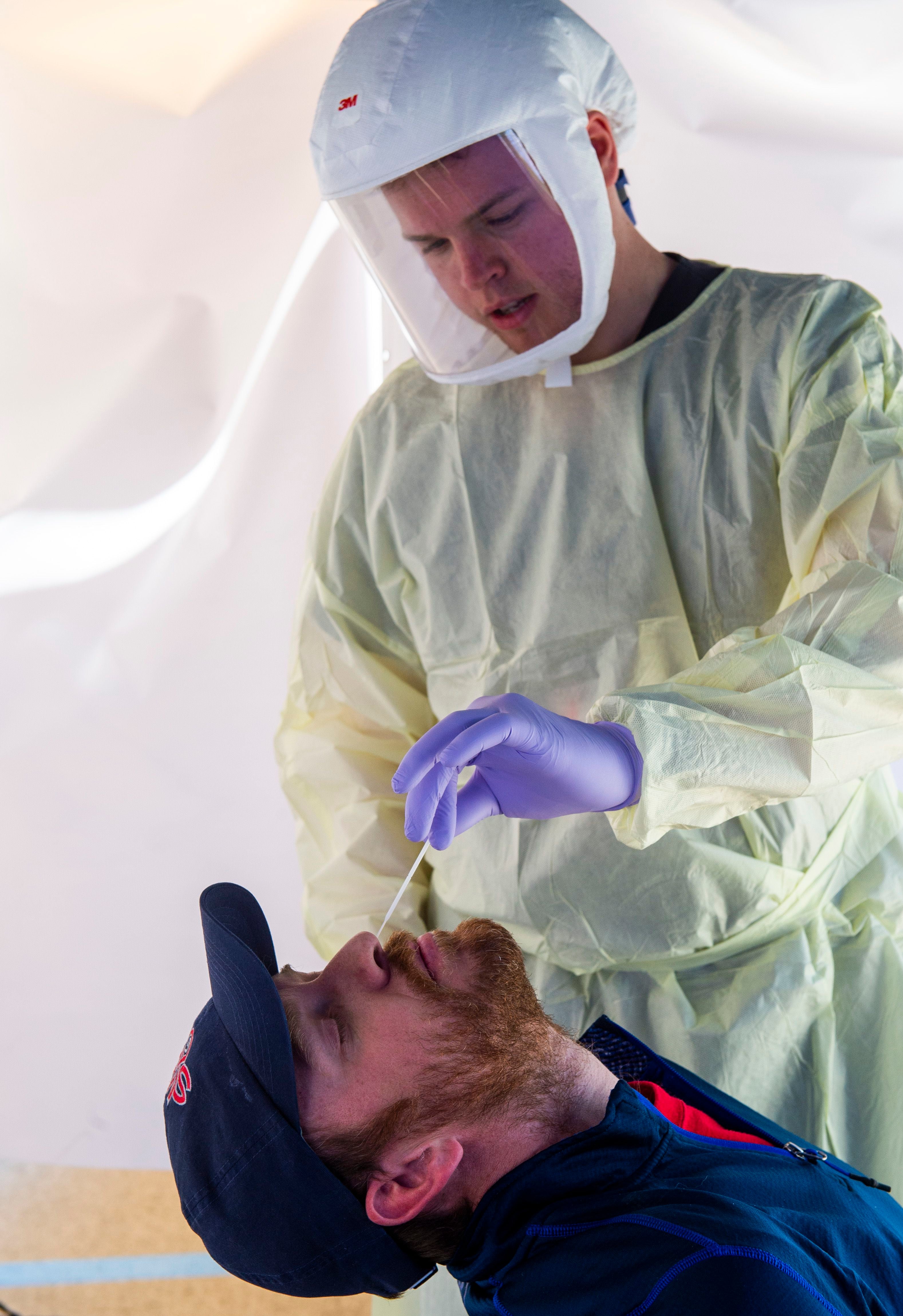 (Rick Egan | The Salt Lake Tribune) David Neeley gets tested by Intermountain Healthcare medical assistant, Connor Meads, at the Intermountain Healthcare Coronavirus Mobile Testing Unit at Utah Valley Hospital in Provo, Friday May 8, 2020.