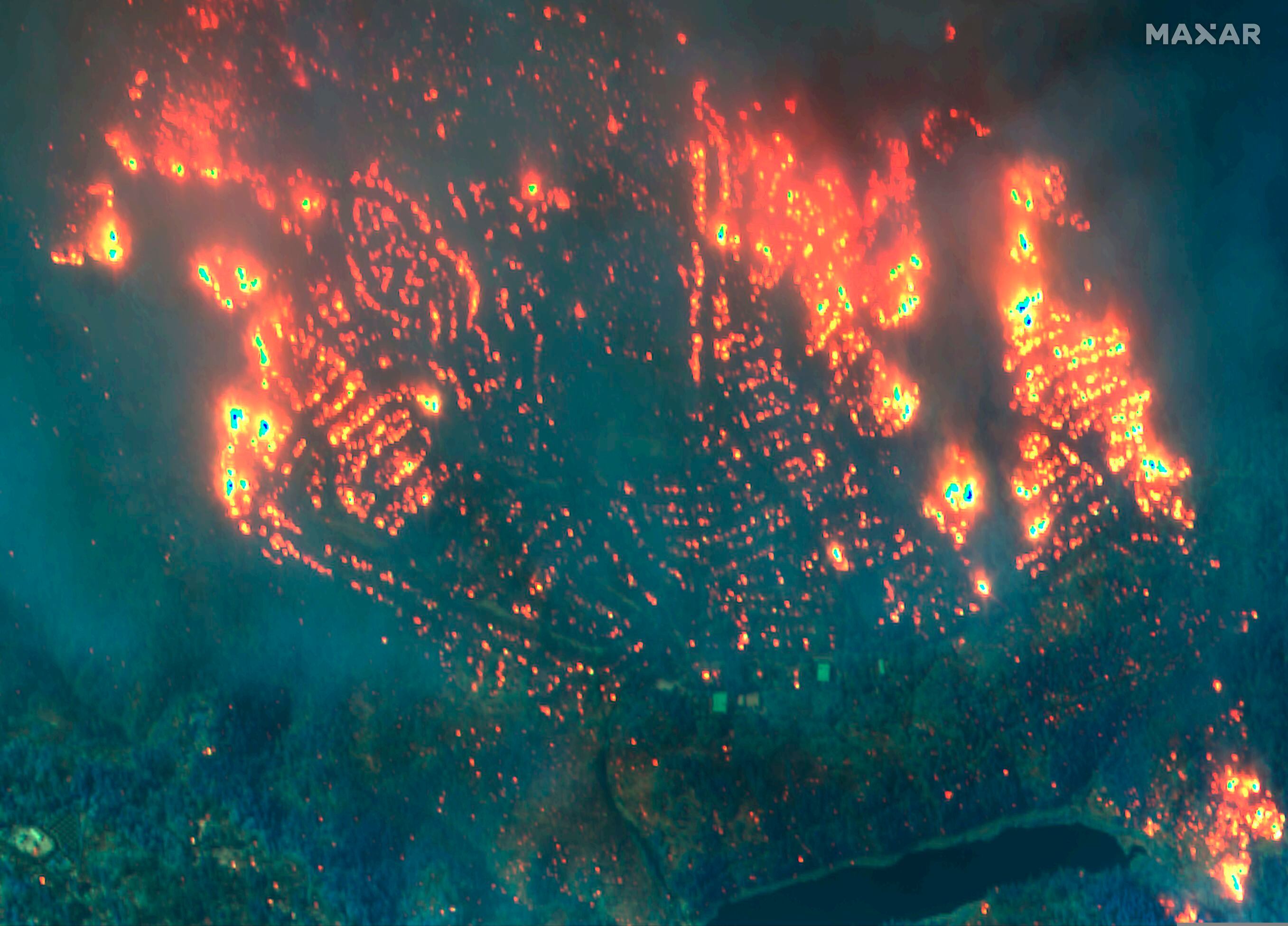 (Satellite image ©2019 Maxar Technologies via AP) This Nov. 9, 2018, image provided by Maxar Technologies shows fires in Paradise, Calif. 