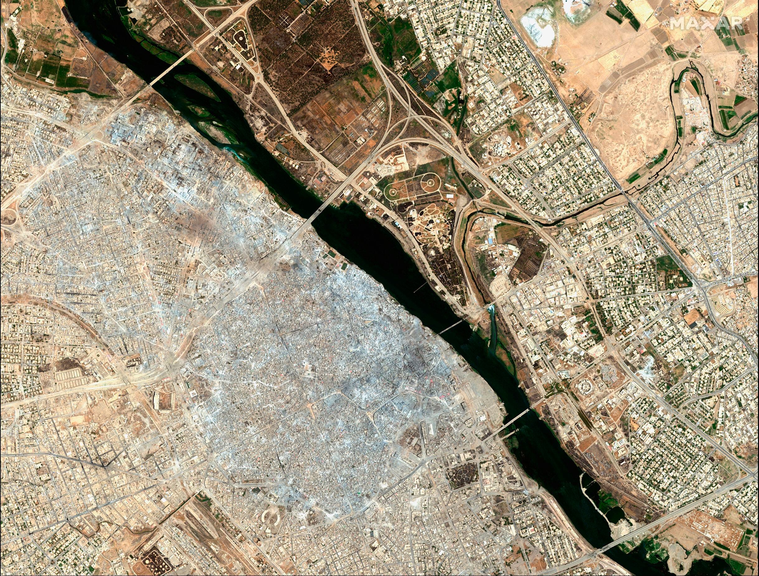 (Satellite image ©2019 Maxar Technologies via AP) This July 8, 2017, image provided by Maxar Technologies shows the Old City of Mosul, Iraq, left, after a punishing nine month battle to oust Islamic State militants. 