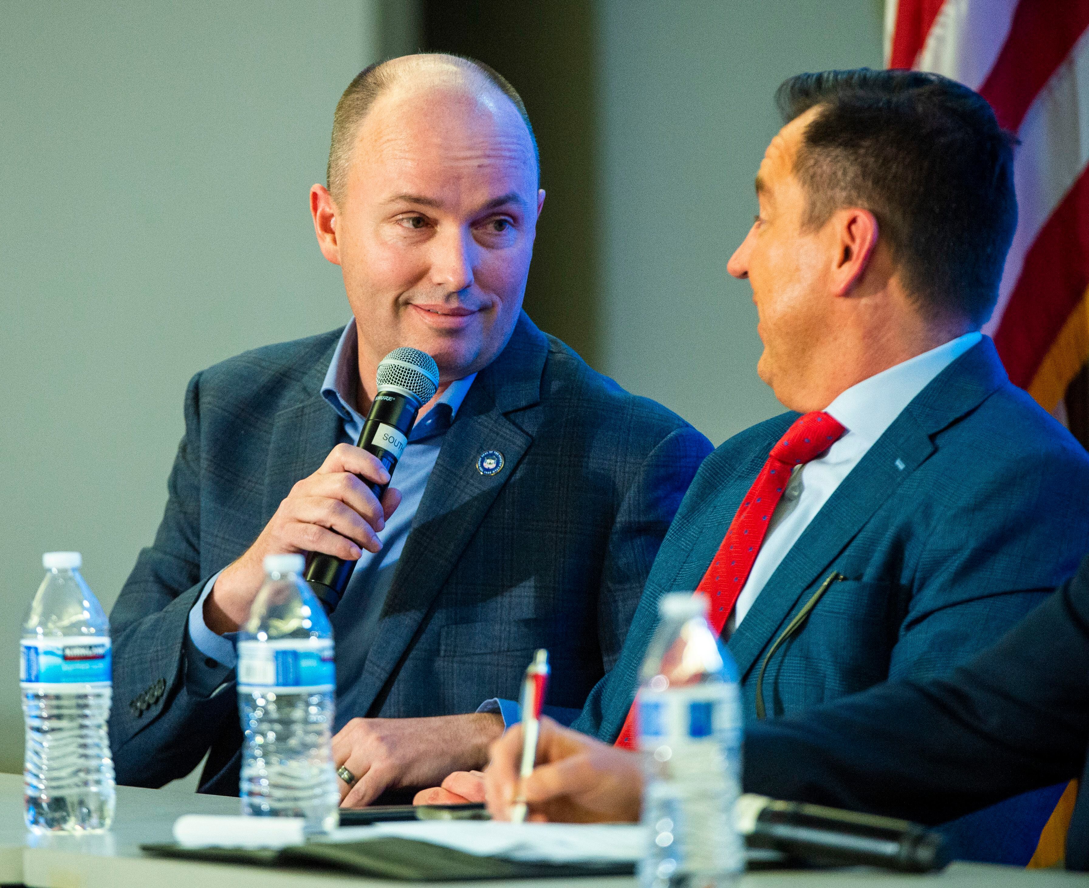 (Rick Egan | The Salt Lake Tribune) Spencer Cox jokes with Greg Hughes, as he answers a question during a Panel of Gubernatorial Candidates, at the annual Utah Eagle Forum Convention, in Sandy, Saturday, Jan. 11, 2020.