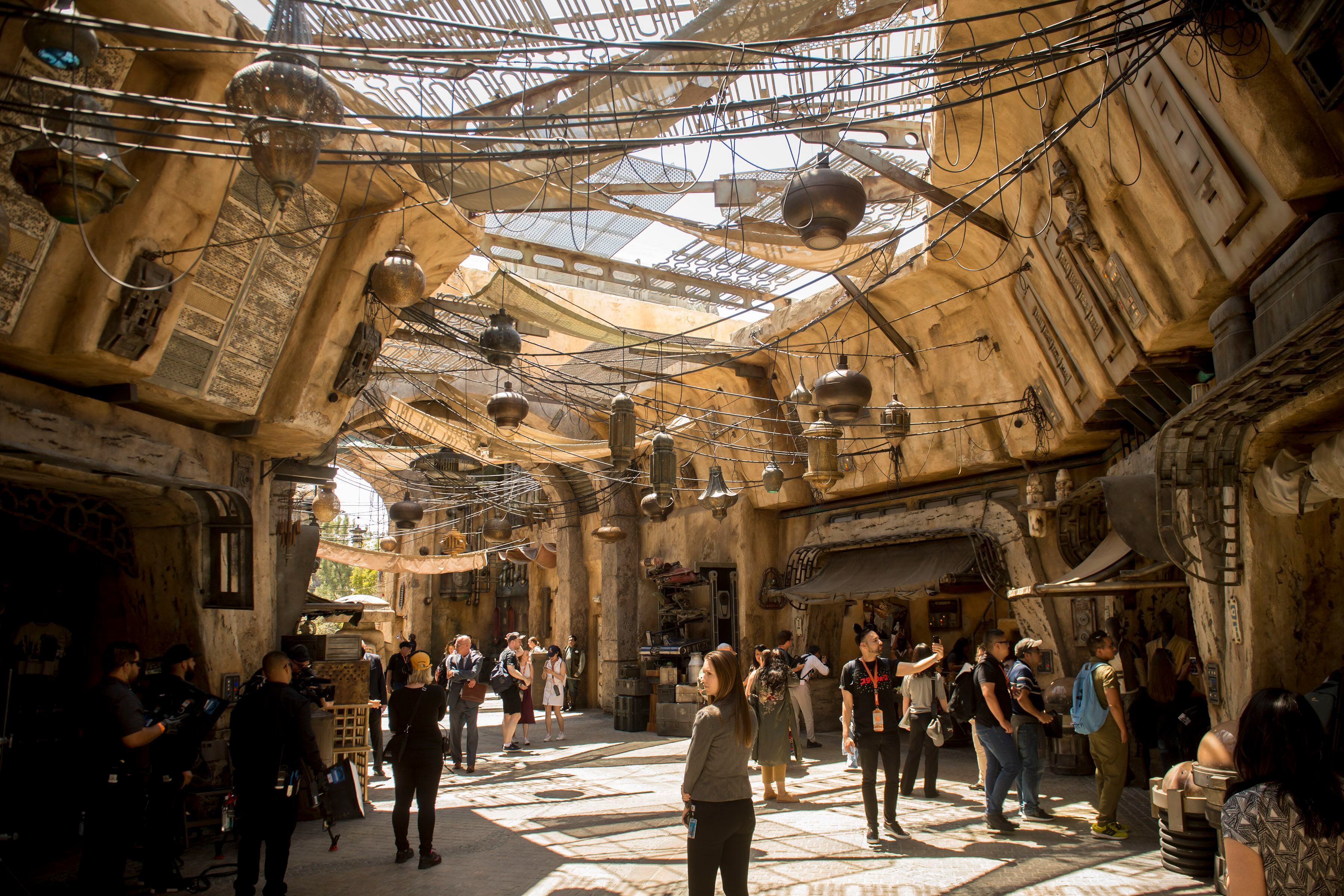 (Jeremy Harmon | The Salt Lake Tribune) Visitors check out the marketplace at Black Spire Outpost at Star Wars: Galaxy's Edge in Anaheim, Ca. on Wednesday, May 29, 2019.