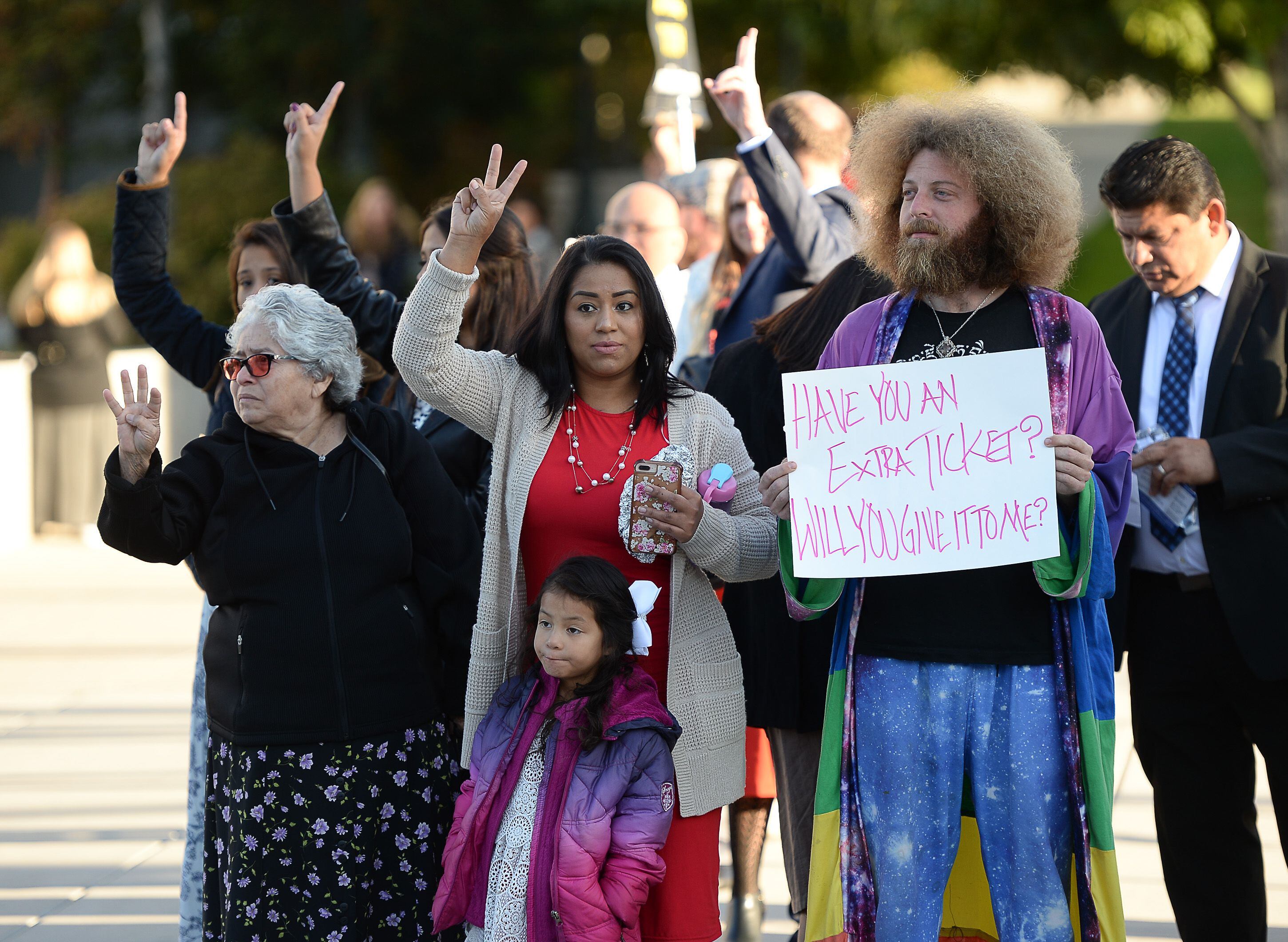 (Francisco Kjolseth | The Salt Lake Tribune) Riley Workman of Payson, Utah, joins those hoping for an entry ticket as people arrive for the Sunday session of the 189th twice-annual General Conference of The Church of Jesus Christ of Latter-day Saints at the Conference Center in Salt Lake City on Sunday, Oct. 6, 2019.