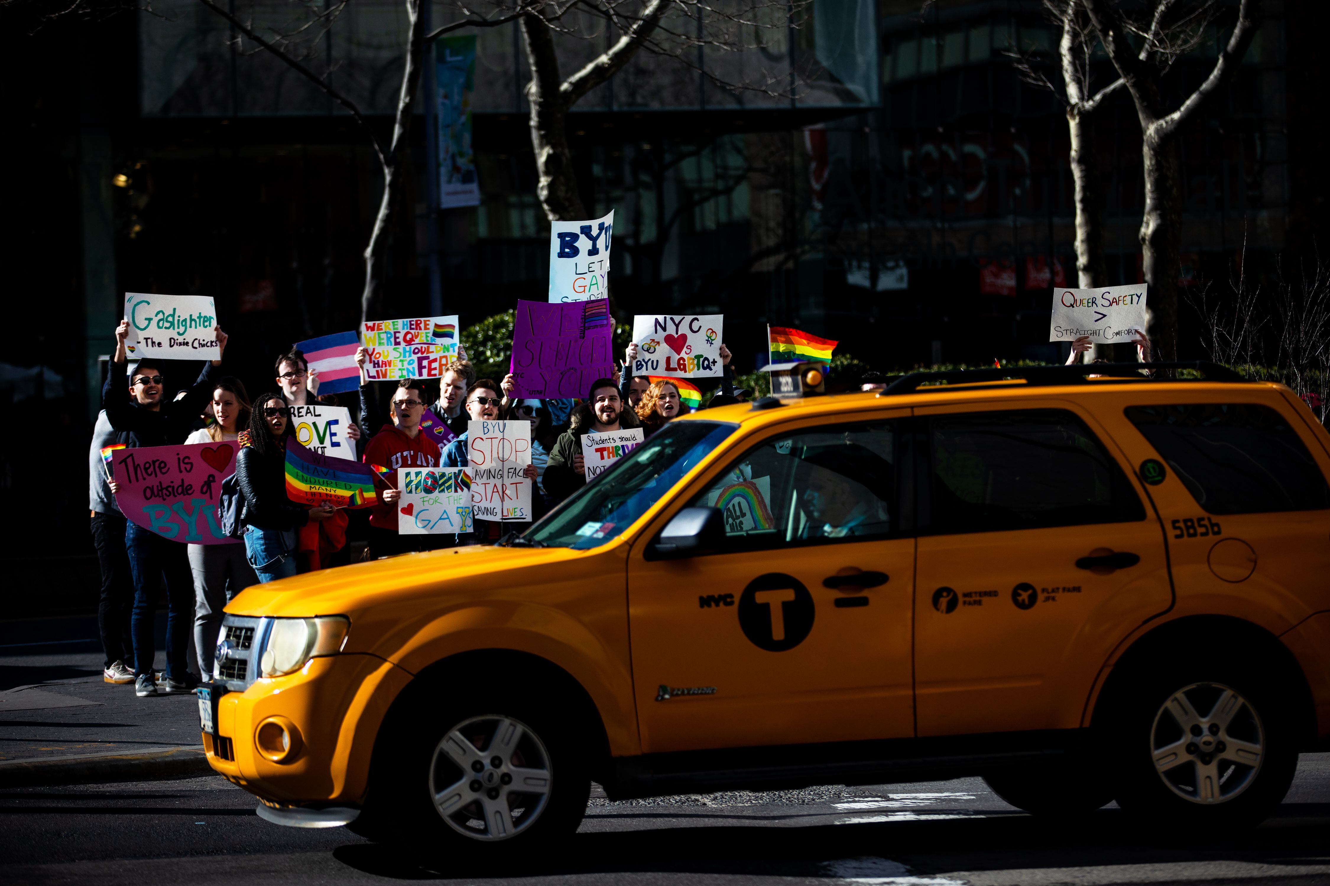 (Demetrius Freeman | for The Salt Lake Tribune) Current and former members of the Church of Jesus Christ of Latter-day Saints, the LGBTQ+ community, and supporters gather at Lincoln square across from the Mormon temple in Manhattan, New York, on March 7, 2020, to stand in solidarity with LGBTQ+ students who attending Brigham Young University. Brigham Young University reinstated homophobic policies in their student handbook that prohibit Òhomosexual behavior.Ó