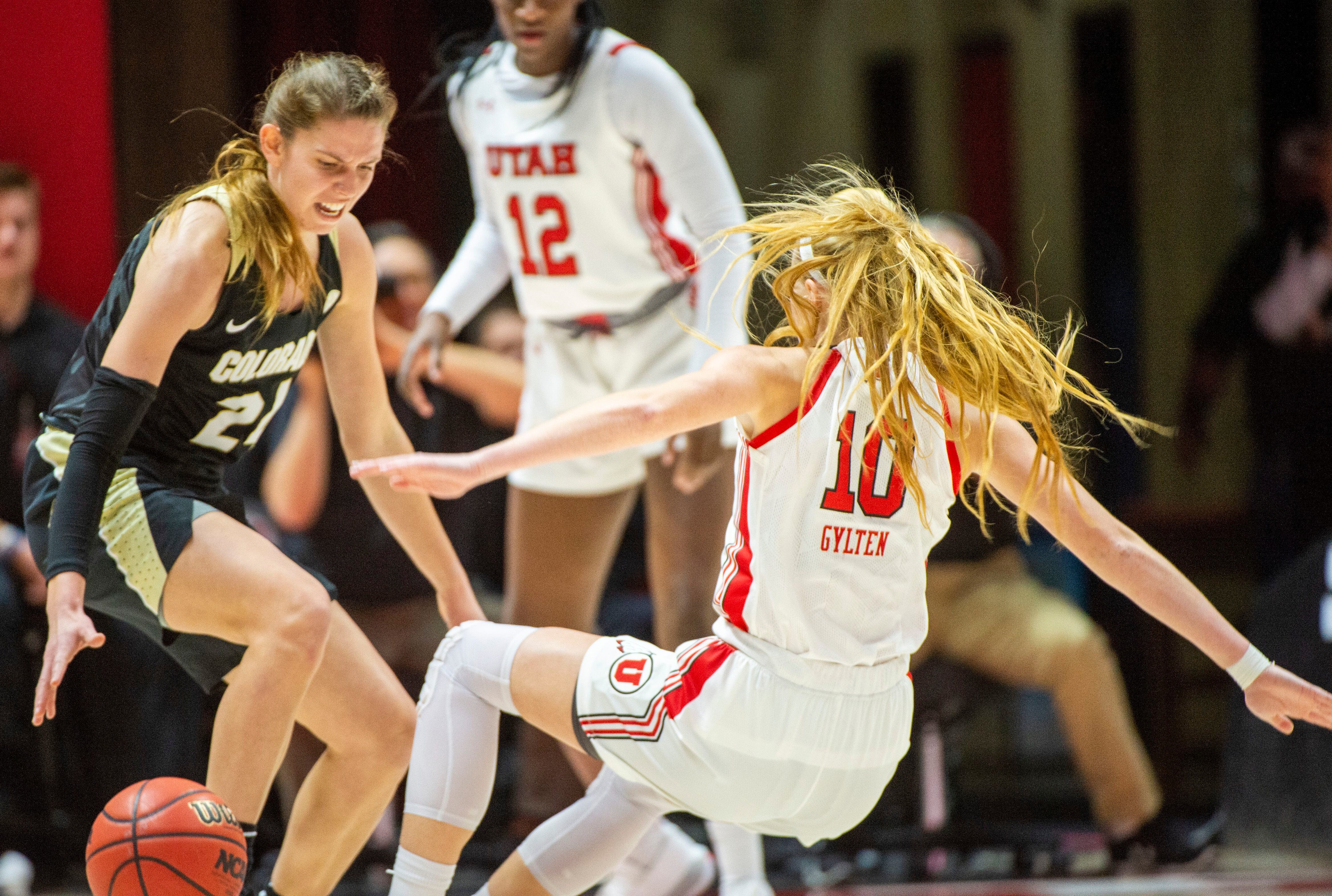 (Rick Egan | The Salt Lake Tribune) Colorado Buffaloes guard Mya Hollingshed (21) is called for an offensive foul, as she collides with Utah guard Dru Gylten (10), in PAC-12 basketball action between the Utah Utes and the Colorado Buffaloes, at the Jon M. Huntsman Center, Sunday, Nov. 29, 2019.