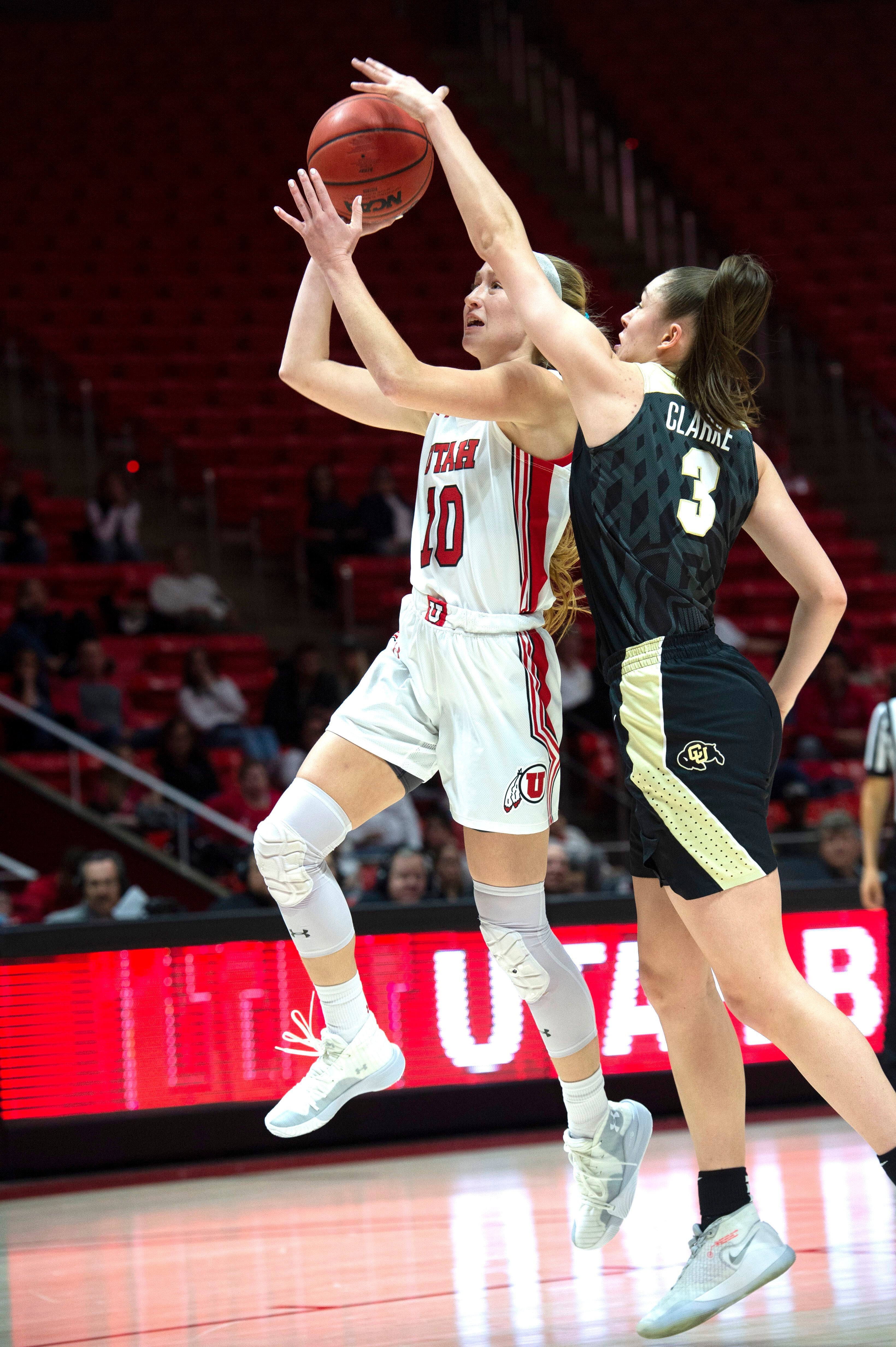 (Rick Egan | The Salt Lake Tribune) Colorado Buffaloes guard Emma Clarke (3) gets her hand on a shot by Utah guard Dru Gylten (10), in PAC-12 basketball action between the Utah Utes and the Colorado Buffaloes, at the Jon M. Huntsman Center, Sunday, Nov. 29, 2019.