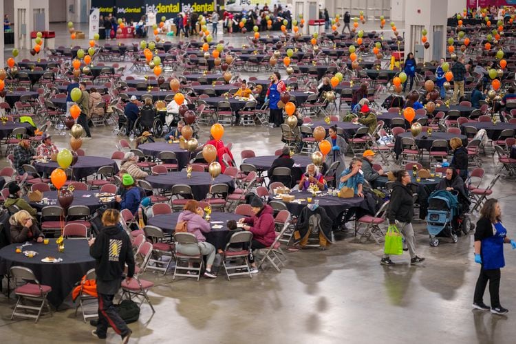 (Trent Nelson  |  The Salt Lake Tribune) Tables set out as the Miller family provides more than 3,000 Thanksgiving meals for people experiencing homelessness at the Salt Palace Convention Center in Salt Lake City on Monday, Nov. 21, 2022.