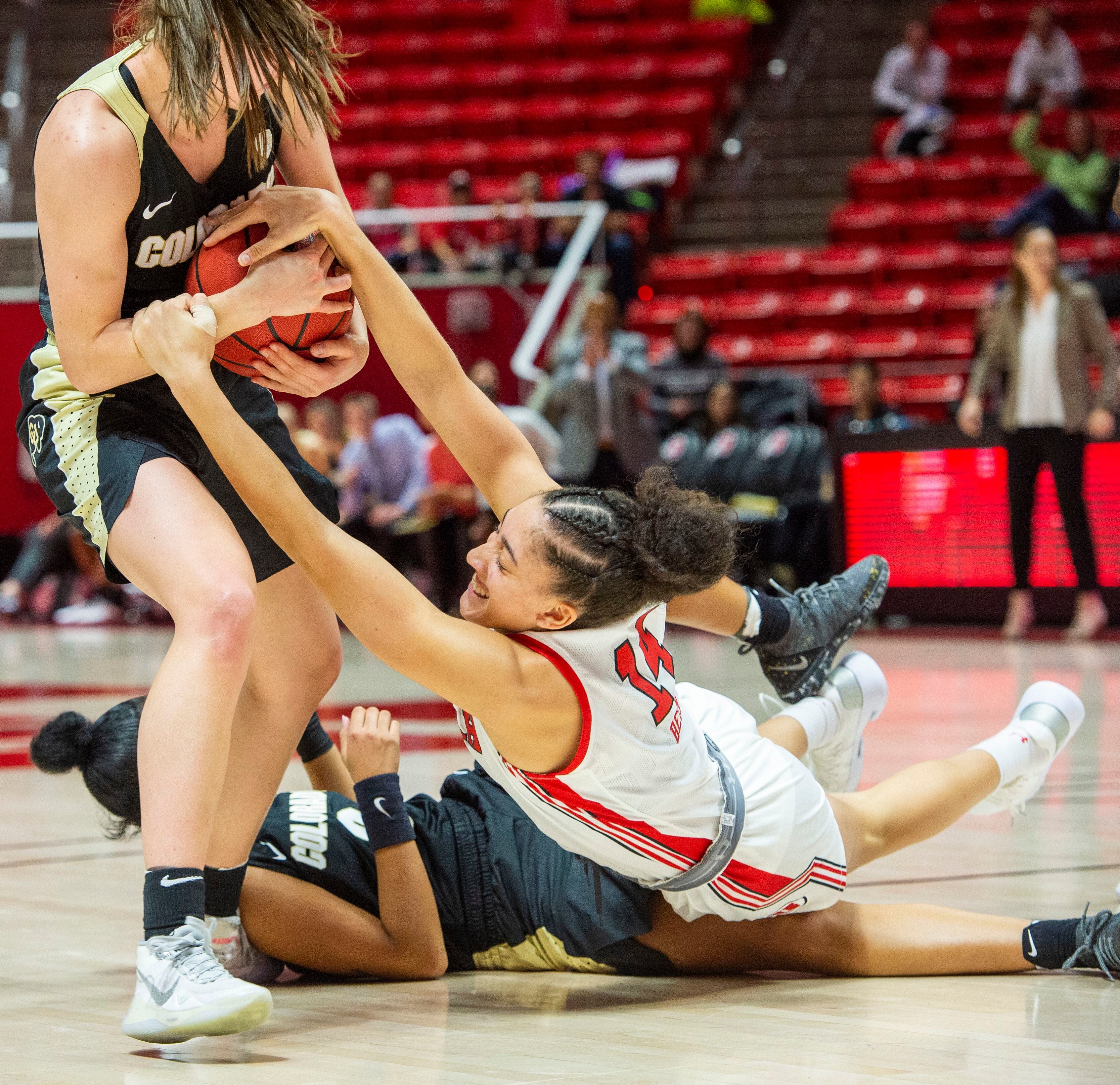 (Rick Egan | The Salt Lake Tribune) Utah Utes guard Niyah Becker (14) tries to grab the ball from Colorado Buffaloes guard Emma Clarke (3), in PAC-12 basketball action between the Utah Utes and the Colorado Buffaloes, at the Jon M. Huntsman Center, Sunday, Nov. 29, 2019.