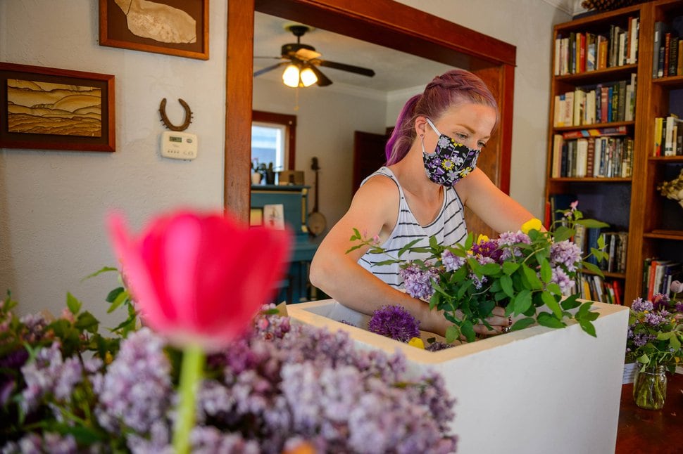 (Trent Nelson | The Salt Lake Tribune) Anna Zack, co-founder of Zack Family Farms, organizing Mother's Day deliveries at her home in Ogden on Saturday, May 9, 2020. Anna and Ben Zack started Zack Family Farms last fall with hopes of selling flowers to florists for weddings. But during COVID-19, they had to adapt and are now making home deliveries with their flowers.