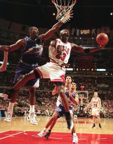 Michael Jordan and the Chicago Bulls defeat the Utah Jazz winning
