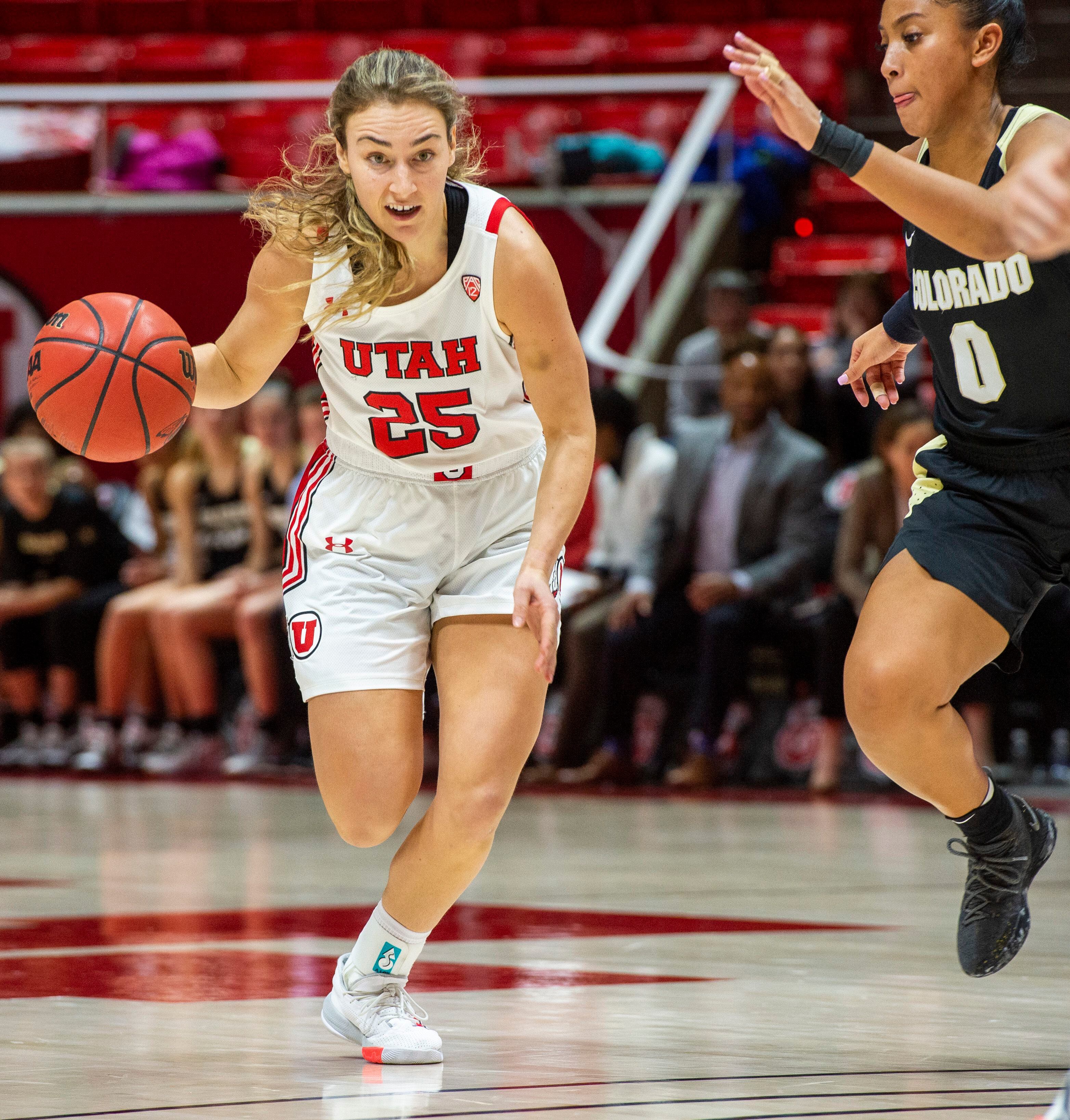 (Rick Egan | The Salt Lake Tribune) Utah Utes guard Julie Brosseau (25) takes the ball down court, as Colorado Buffaloes guard Quinessa Caylao-Do (0) defends, in PAC-12 basketball action between the Utah Utes and the Colorado Buffaloes, at the Jon M. Huntsman Center, Sunday, Nov. 29, 2019.