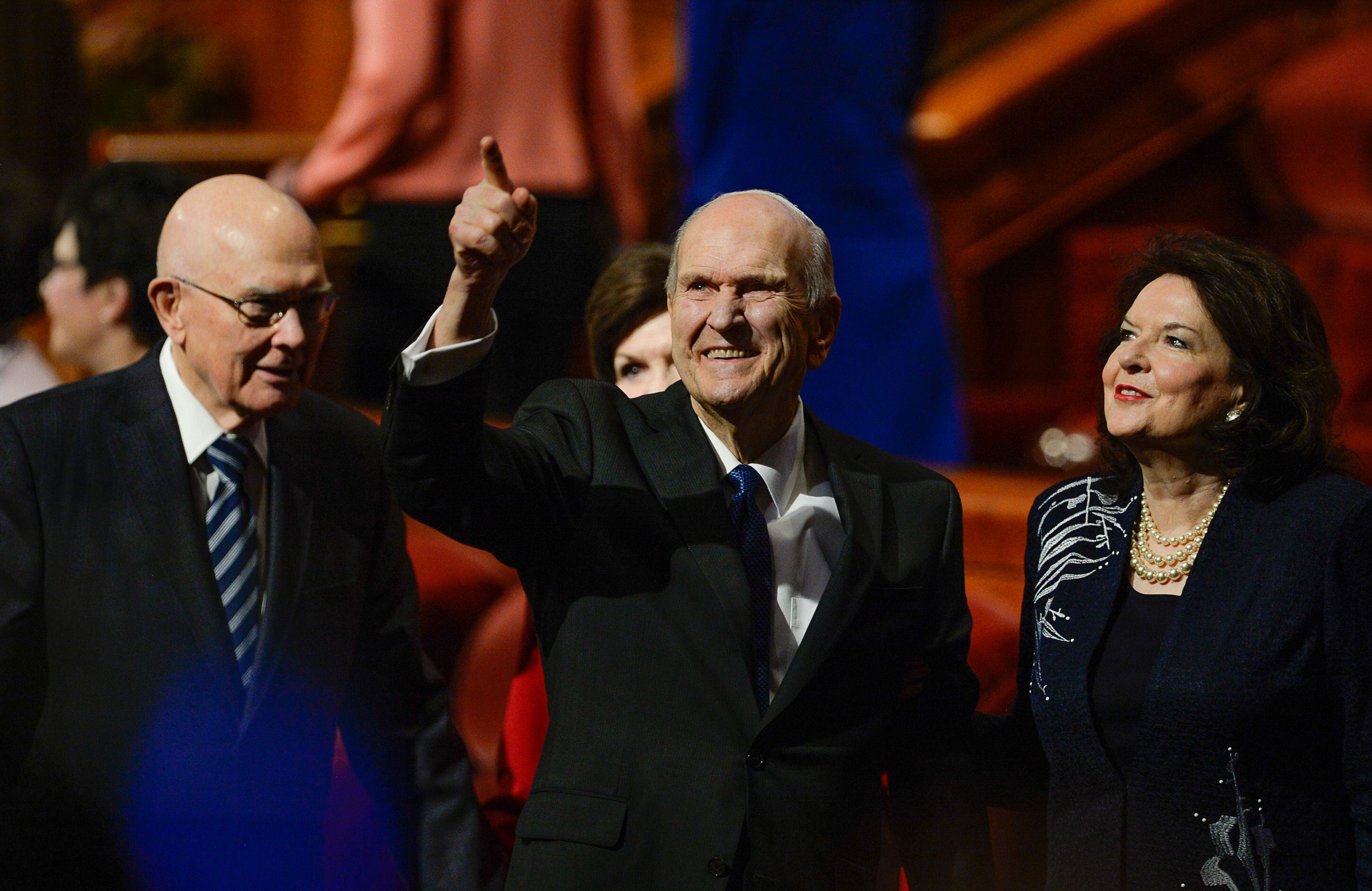 (Francisco Kjolseth | The Salt Lake Tribune) President Russell M. Nelson waves to the crowd as he and his wife, Sister Wendy Nelson, exit at the conclusion of the Sunday morning session of the 189th twice-annual General Conference of The Church of Jesus Christ of Latter-day Saints at the Conference Center in Salt Lake City on Sunday, Oct. 6, 2019. At left is President Dallin H. Oaks, first counselor in the First Presidency of The Church of Jesus Christ of Latter-day Saints