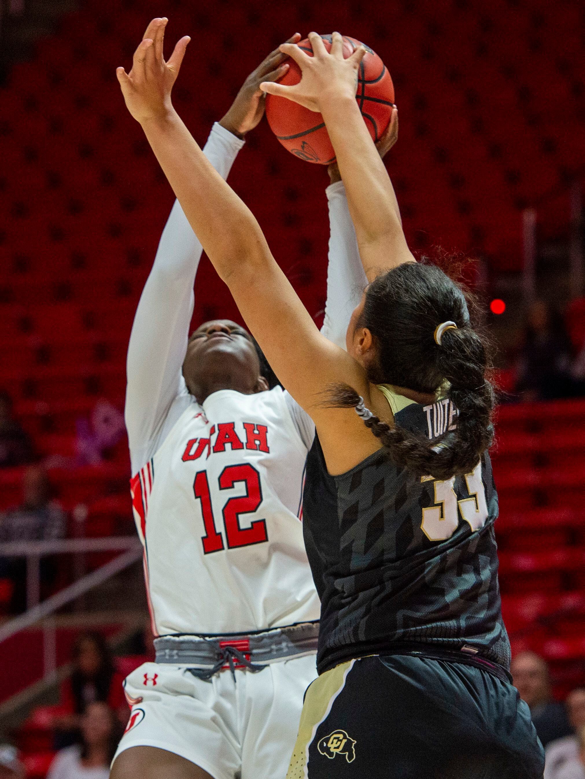 (Rick Egan | The Salt Lake Tribune) Colorado Buffaloes forward Peanut Tuitele (33) blocks a shot by Utah Utes forward Lola Pendande (12) , in PAC-12 basketball action between the Utah Utes and the Colorado Buffaloes, at the Jon M. Huntsman Center, Sunday, Nov. 29, 2019.