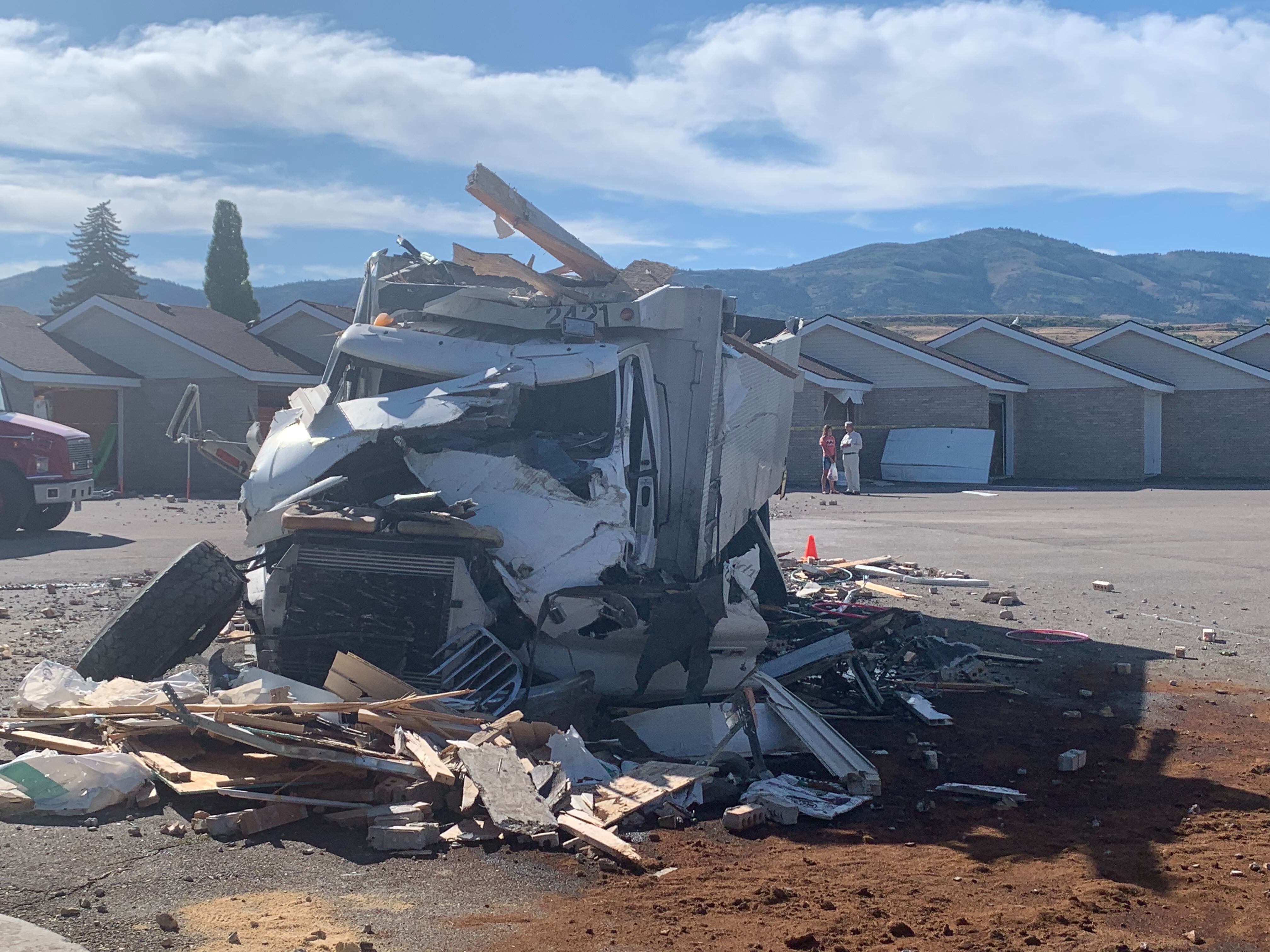 (John Franchi | FOX 13 News) A wrecked truck rests near a Garden City condo complex where it crashed into some of the buildings on Aug. 20, 2019.