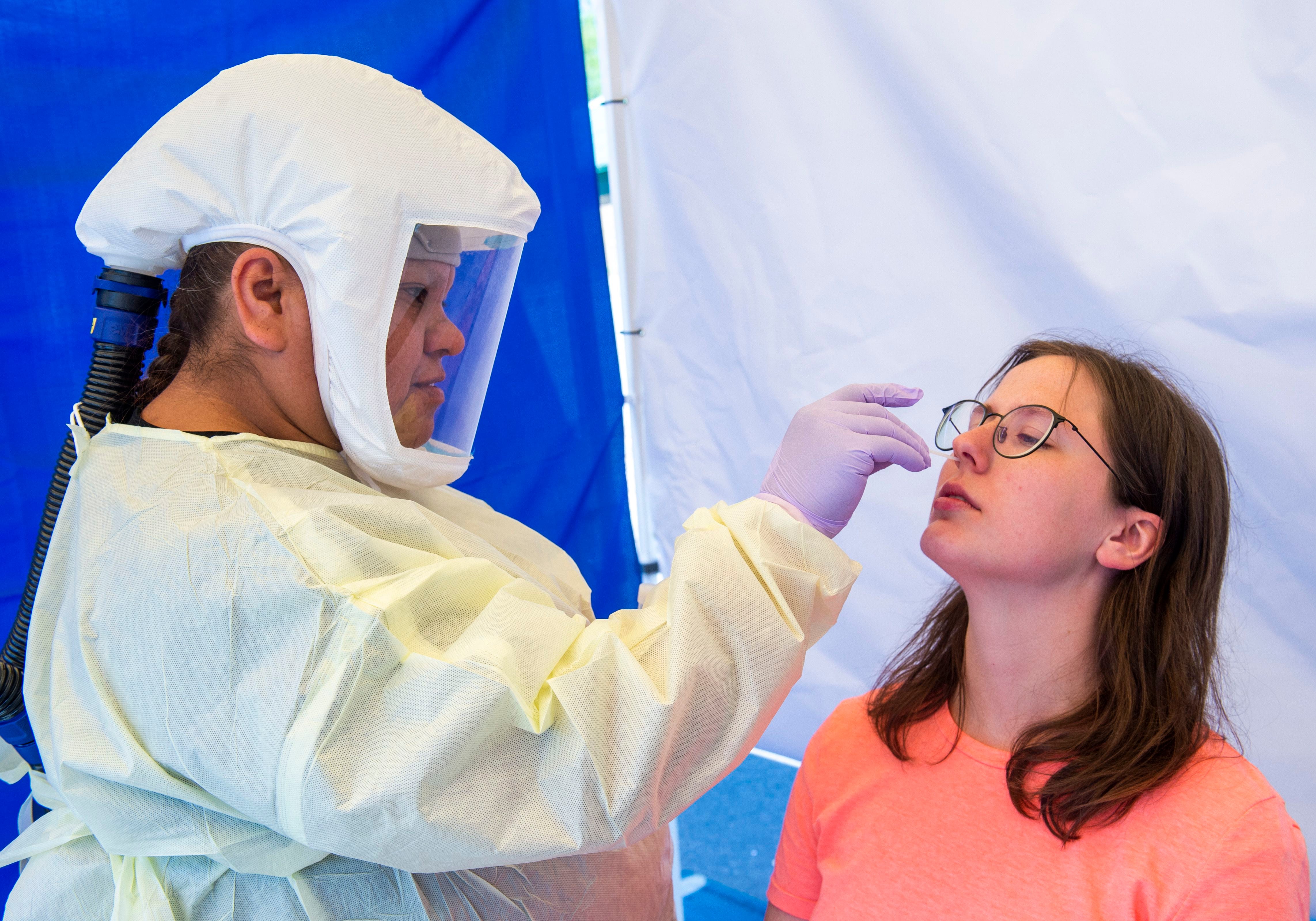 (Rick Egan | The Salt Lake Tribune) Intermountain Healthcare medical assistant, Latoya Dovila, tests Kathy Jackson at the Intermountain Healthcare Coronavirus Mobile Testing Unit at Utah Valley Hospital in Provo, Friday May 8, 2020