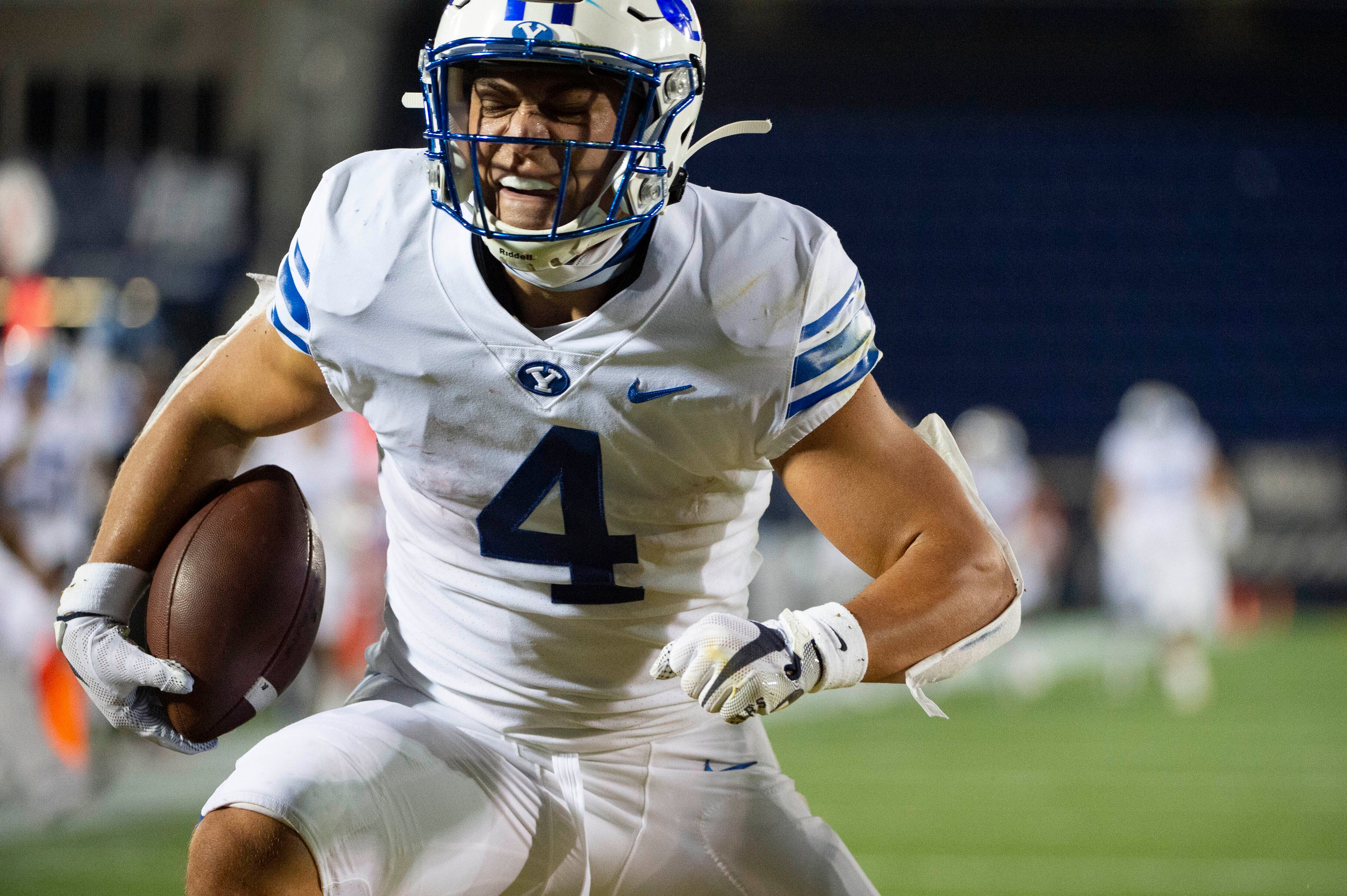 BYU's Lopini Katoa (4) reacts after scoring a touchdown during the first half of an NCAA college football game against Navy, Monday, Sept. 7, 2020, in Annapolis, Md. (AP Photo/Tommy Gilligan)