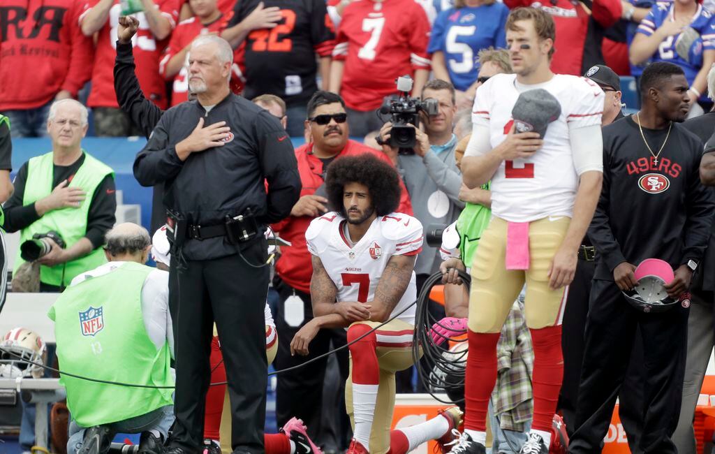 Football fans burn Kaepernick's jersey in protest of his protest