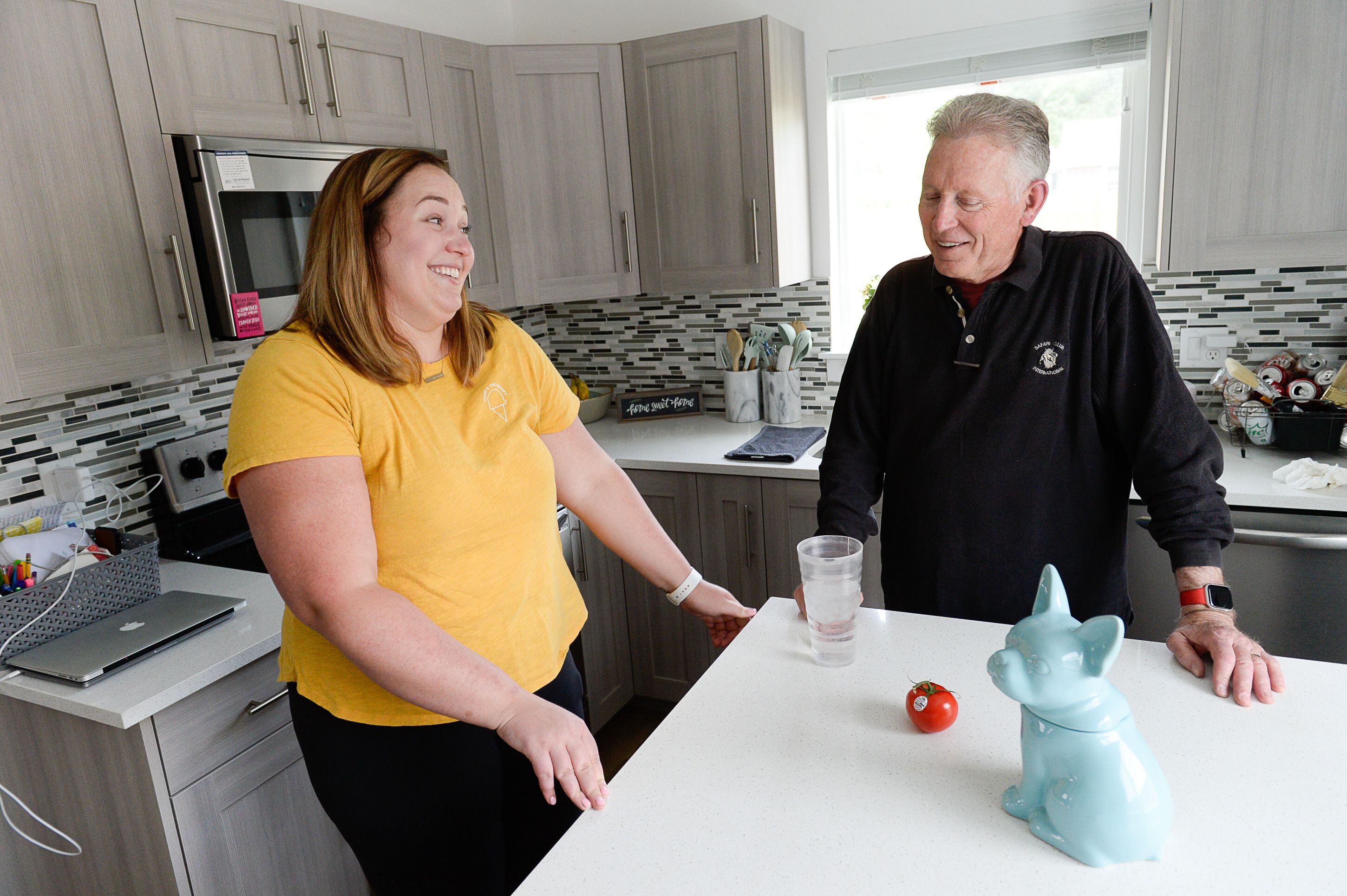 (Francisco Kjolseth | The Salt Lake Tribune) Courtney Hatch talks with her father Floyd about the genetic health issues that have affected the family over the years at her house in Sugarhouse on Wed. June 12, 2019. Intermountain Healthcare is beginning a global collaboration and study to discover new links between genetics and human disease that will involve the collection of half-a-million DNA samples. This initiative focuses on people with the PKP2 gene, a mutation that can lead to heart failure. Both Courtney and her father have the genetic condition, and are participating in the study.