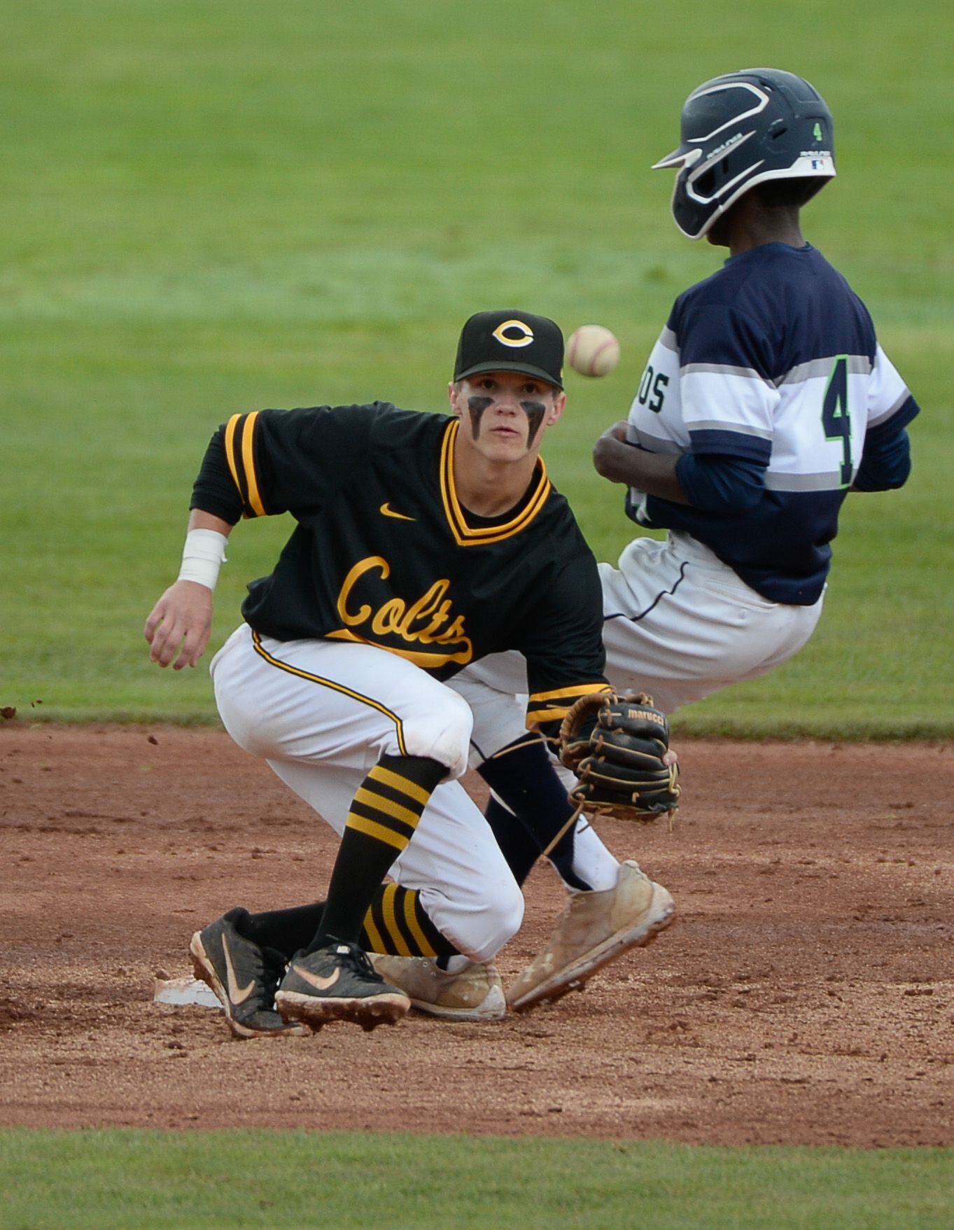 (Francisco Kjolseth | The Salt Lake Tribune) Cade Perkins of Cottonwood keeps his eye on the ball as Will Thomas of Timpanogos slips safely in to second base during the 5A baseball championship game at UCCU Stadium on the UVU campus in Orem, Friday, May 24, 2019.