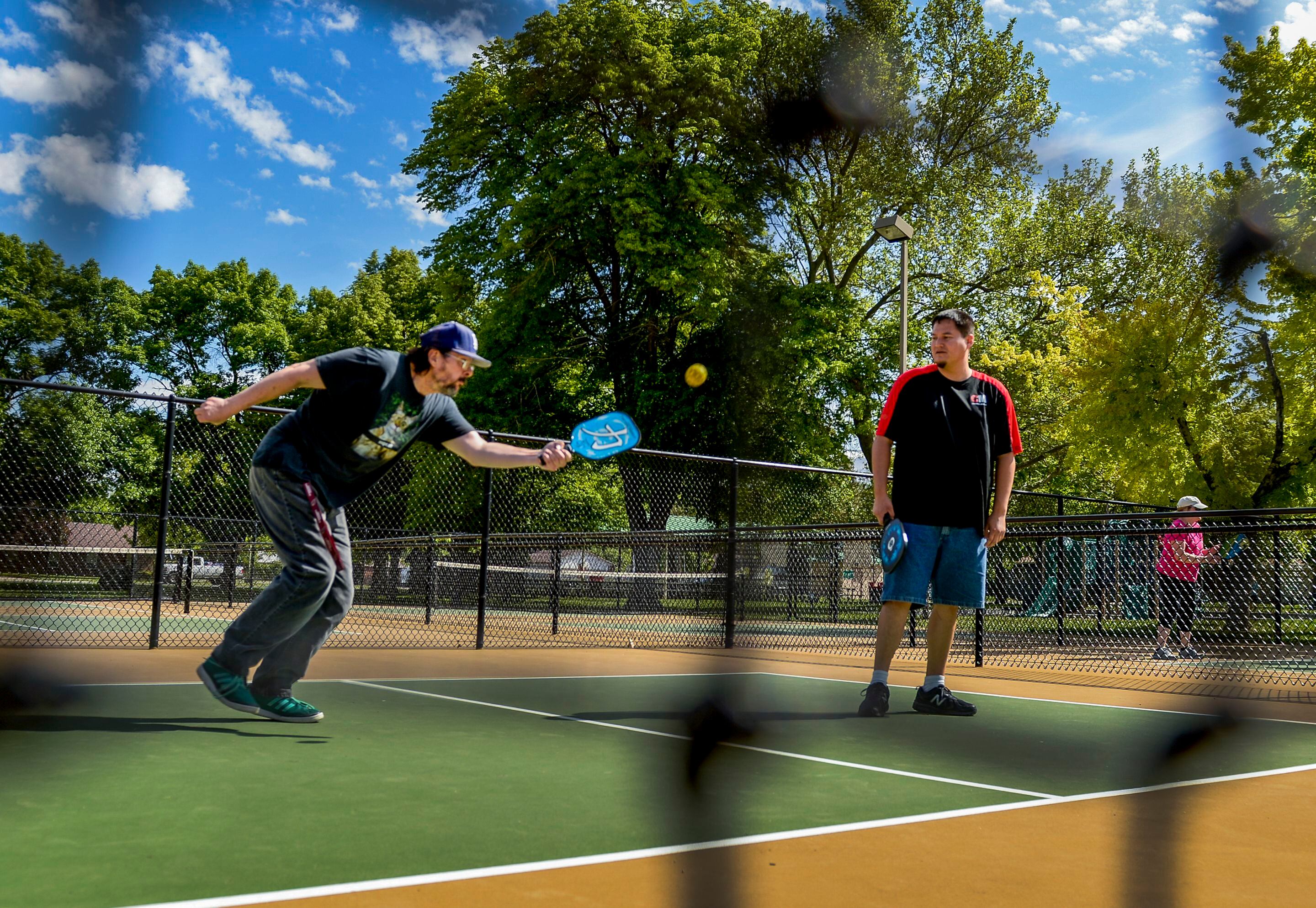 (Leah Hogsten | The Salt Lake Tribune) l-r Veterans Peter Gray and Dakoda Antelope play pickleball at Hogan Park in Bountiful, May 14, 2019. Veteran suicide rates in Utah, are second highest, with the exception of Montana. The non-profit group Continue Mission serves the Veteran population to heal physical, mental, and emotional injuries through recreational programs like pickleball to promote health, mental well-being and positive life changing experiences.