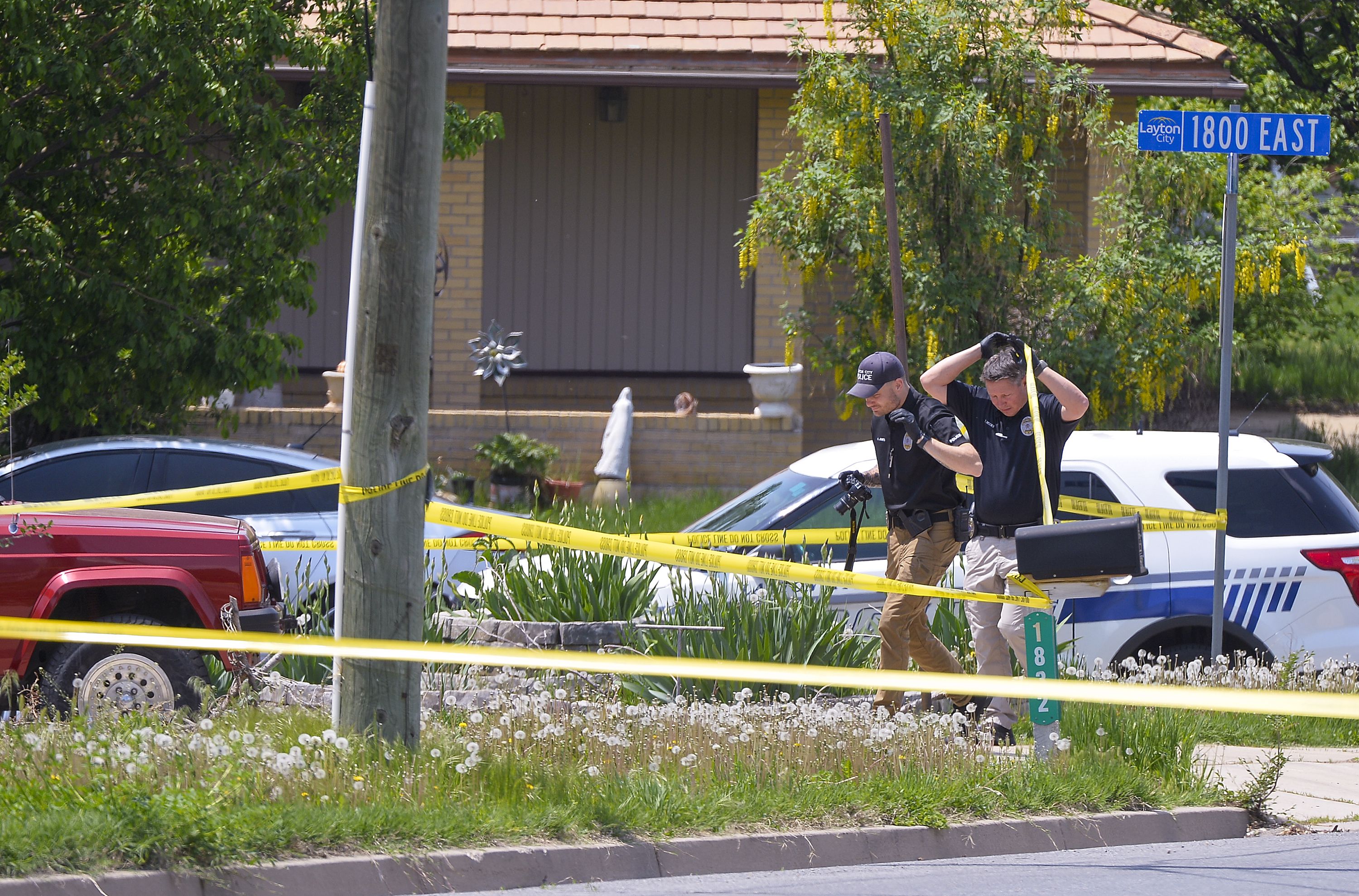 (Chris Samuels | The Salt Lake Tribune) Officials investigate a home in Layton where police say a man killed his wife and the woman's father and stepmother before being taken into custody, Friday, May 19, 2023.