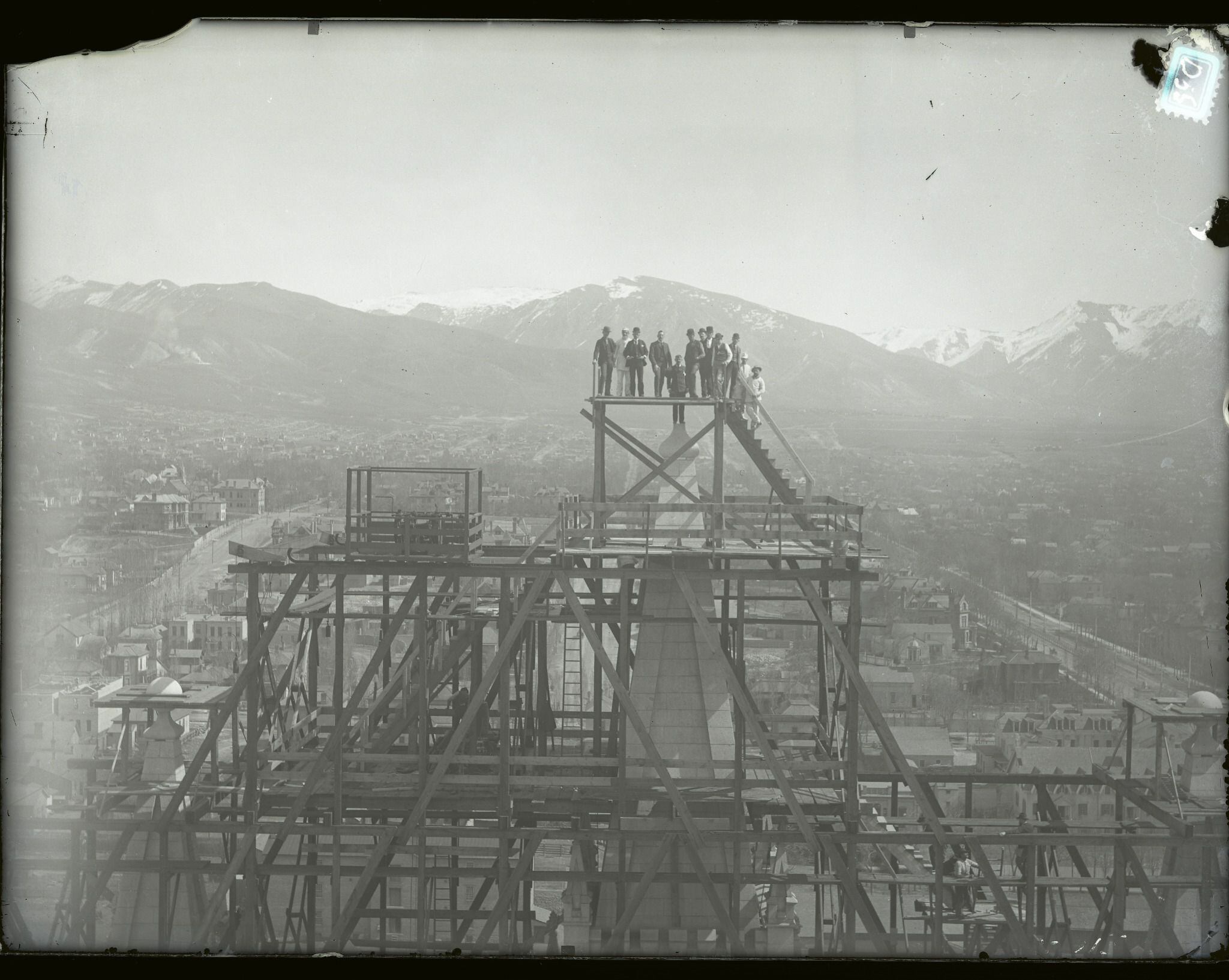(photo courtesy The Church of Jesus Christ of Latter-day Saints) Workers stand atop the Salt Lake Temple before the placement of the capstone in April 1892.
