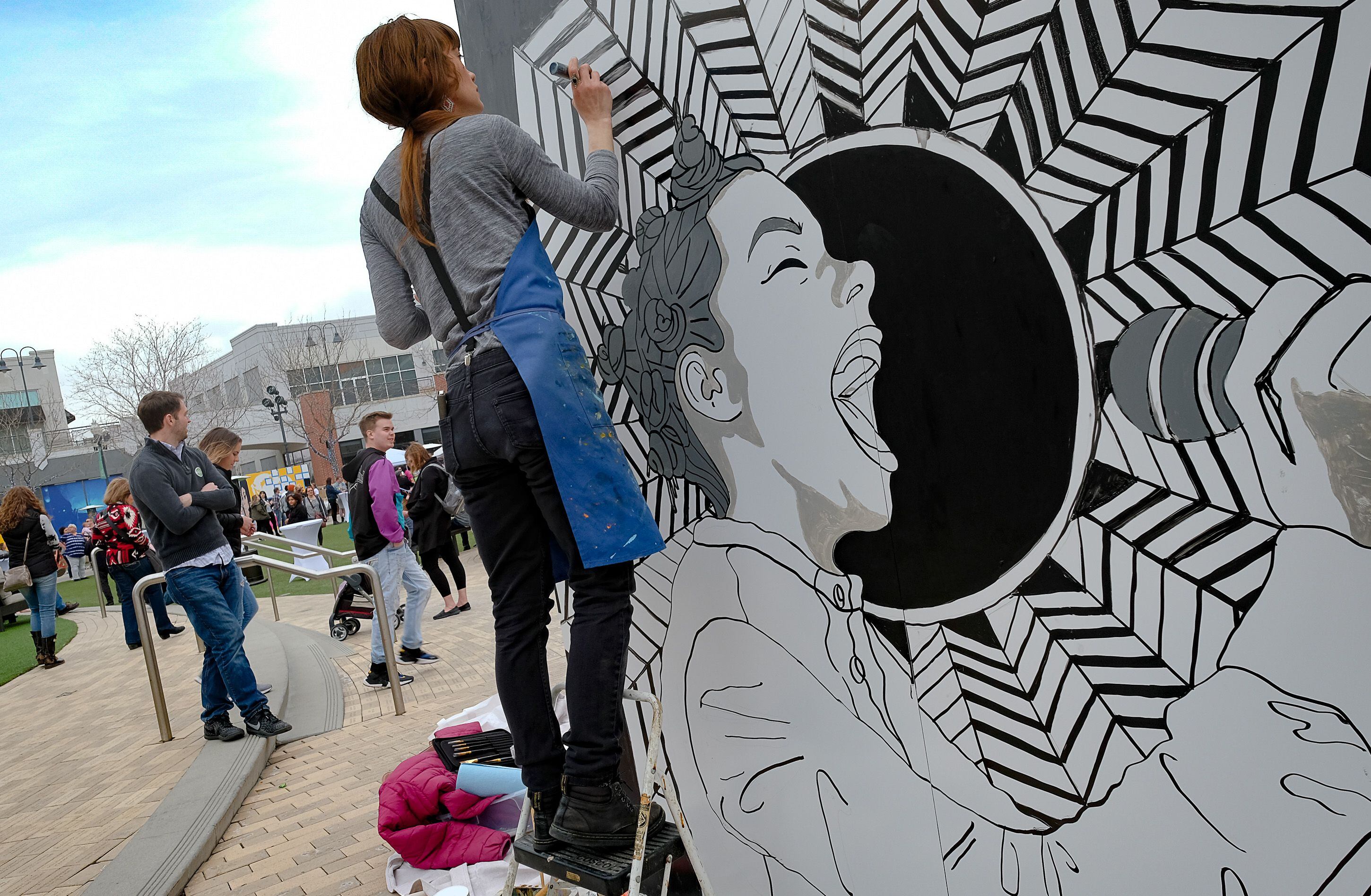 (Francisco Kjolseth | The Salt Lake Tribune) Brooklyn Ottens works on a painting of Bjork as The Gateway, KRCL Radio and The Blocks partner up to celebrate women in music on International WomenÕs Day with the "Queens of Music Festival," at The Gateway on Saturday, March 7, 2020, with vendors that support women run business, interactive mural paintings and live music.