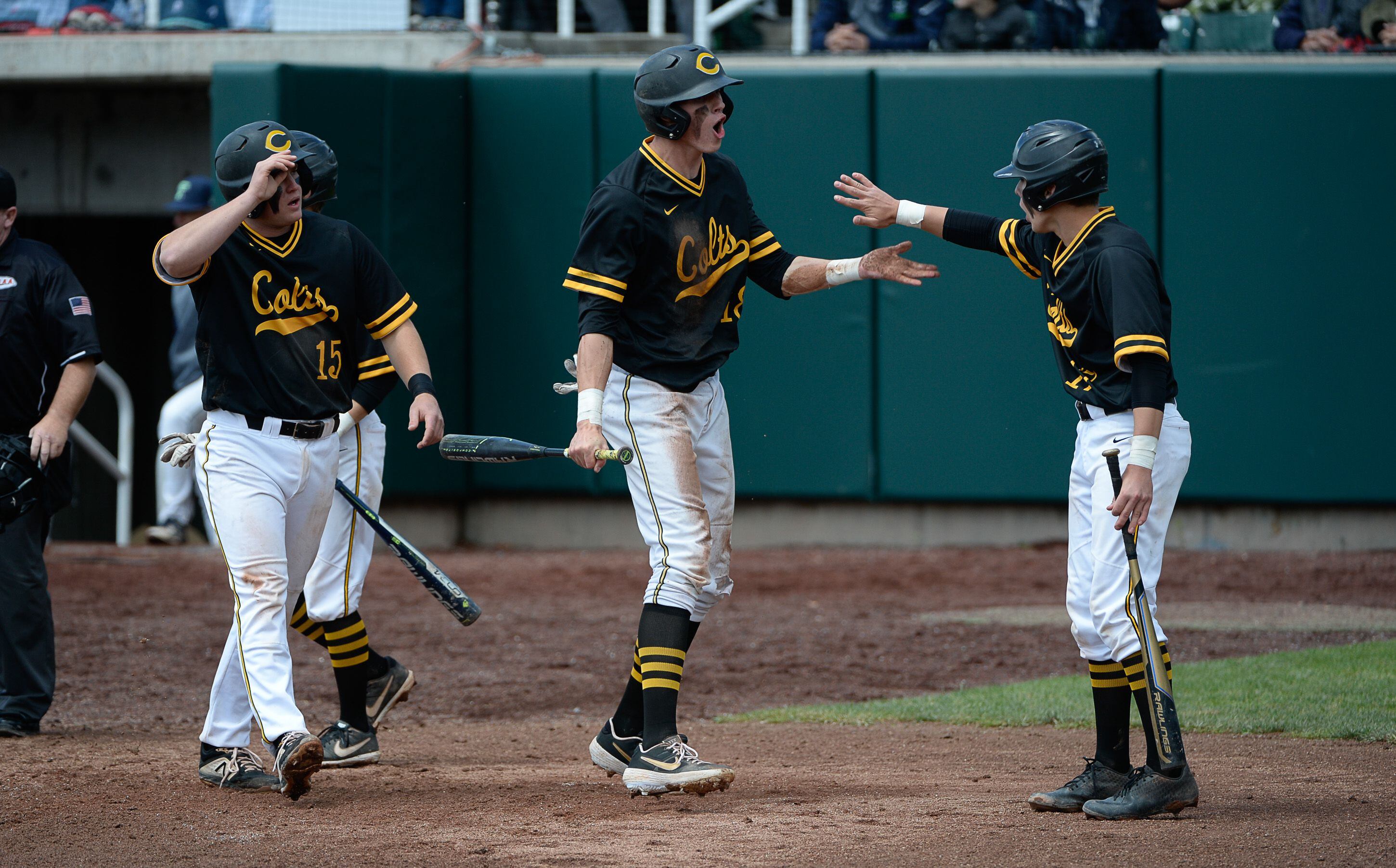 (Francisco Kjolseth | The Salt Lake Tribune) Cottonwood's Dylan Reiser, center, celebrates a run with teammates during the 5A baseball championship game at UCCU Stadium on the UVU campus in Orem, Friday, May 24, 2019.