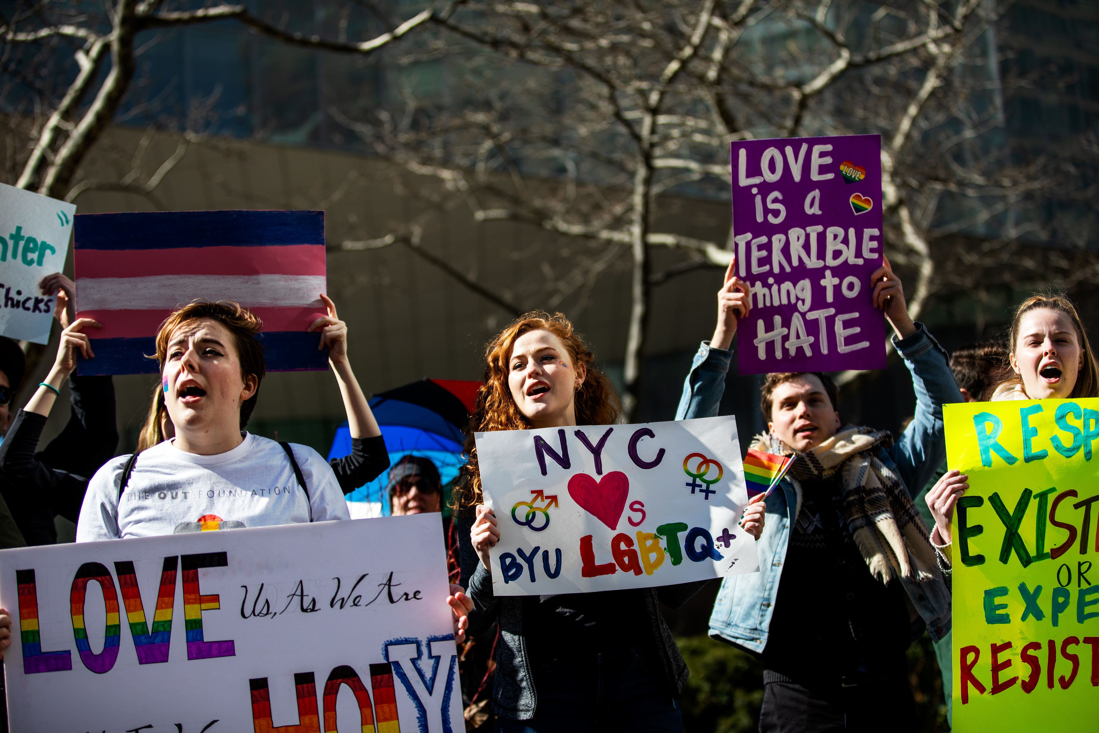 (Demetrius Freeman | for The Salt Lake Tribune) Maddie Hall, 25, center, chants with current and former members of The Church of Jesus Christ of Latter-day Saints, the LGBTQ+ community, and supporters protest at Lincoln Square across from the Latter-day Saints temple in Manhattan on Saturday, March 7, 2020. BYU reinstated policies in its student handbook that prohibit "homosexual behavior."