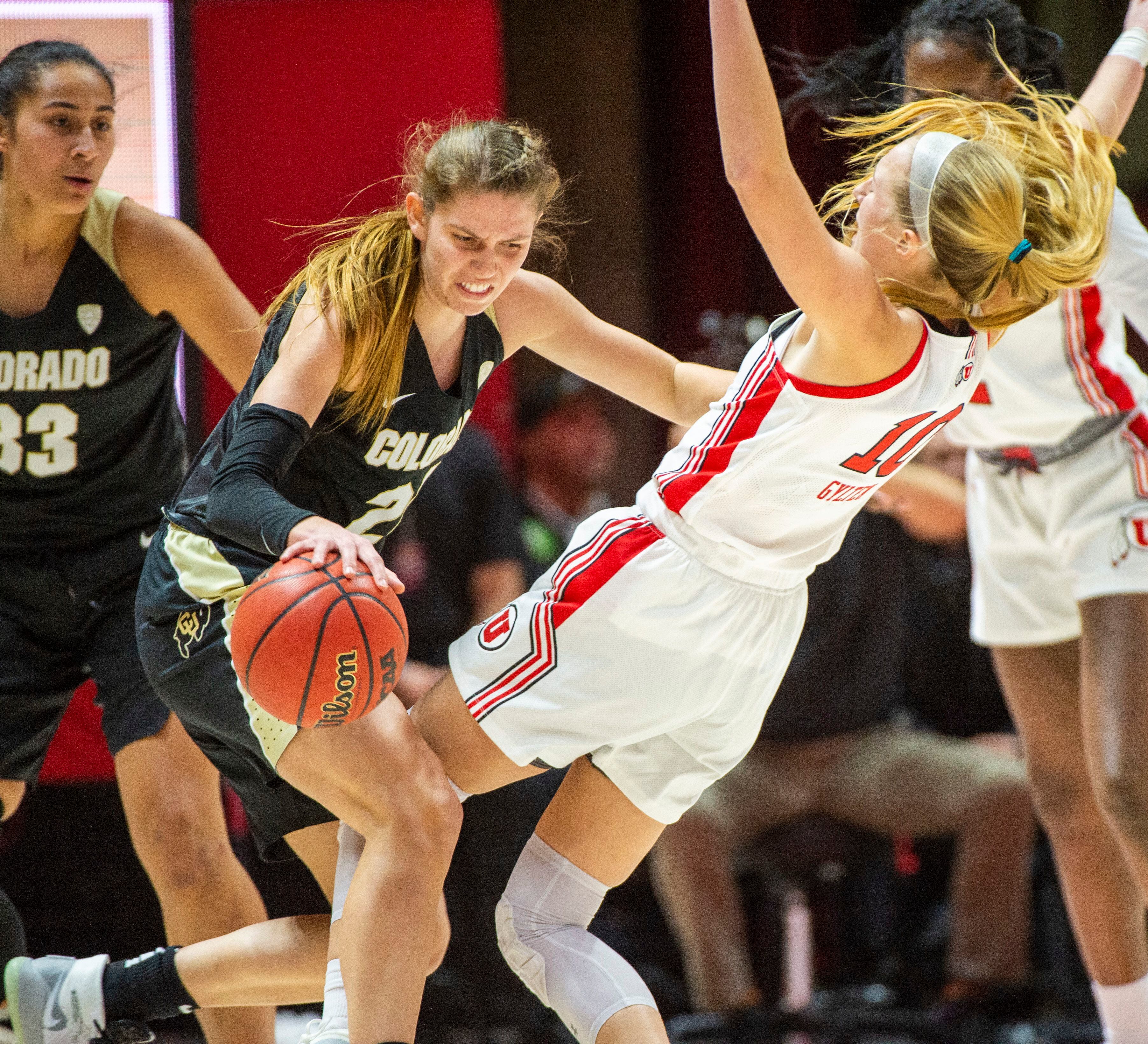 (Rick Egan | The Salt Lake Tribune) Colorado Buffaloes guard Mya Hollingshed (21) is called for an offensive foul, as she collides with Utah guard Dru Gylten (10), in PAC-12 basketball action between the Utah Utes and the Colorado Buffaloes, at the Jon M. Huntsman Center, Sunday, Nov. 29, 2019.