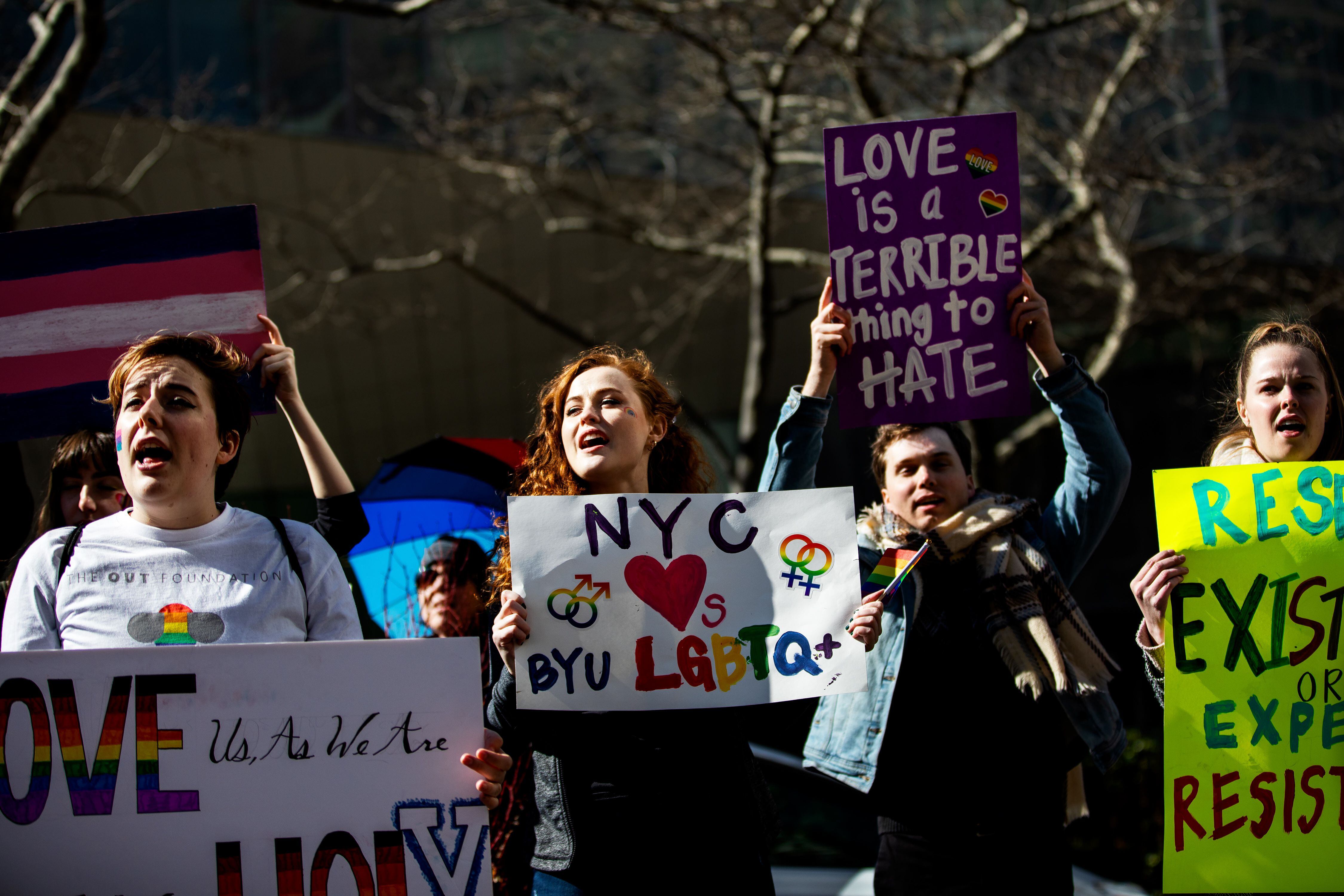 (Demetrius Freeman | for The Salt Lake Tribune) Maddie Hall, 25, center, chants with current and former members of The Church of Jesus Christ of Latter-day Saints, the LGBTQ+ community, and supporters protest at Lincoln Square across from the Latter-day Saints temple in Manhattan on Saturday, March 7, 2020. BYU reinstated policies in its student handbook that prohibit "homosexual behavior."