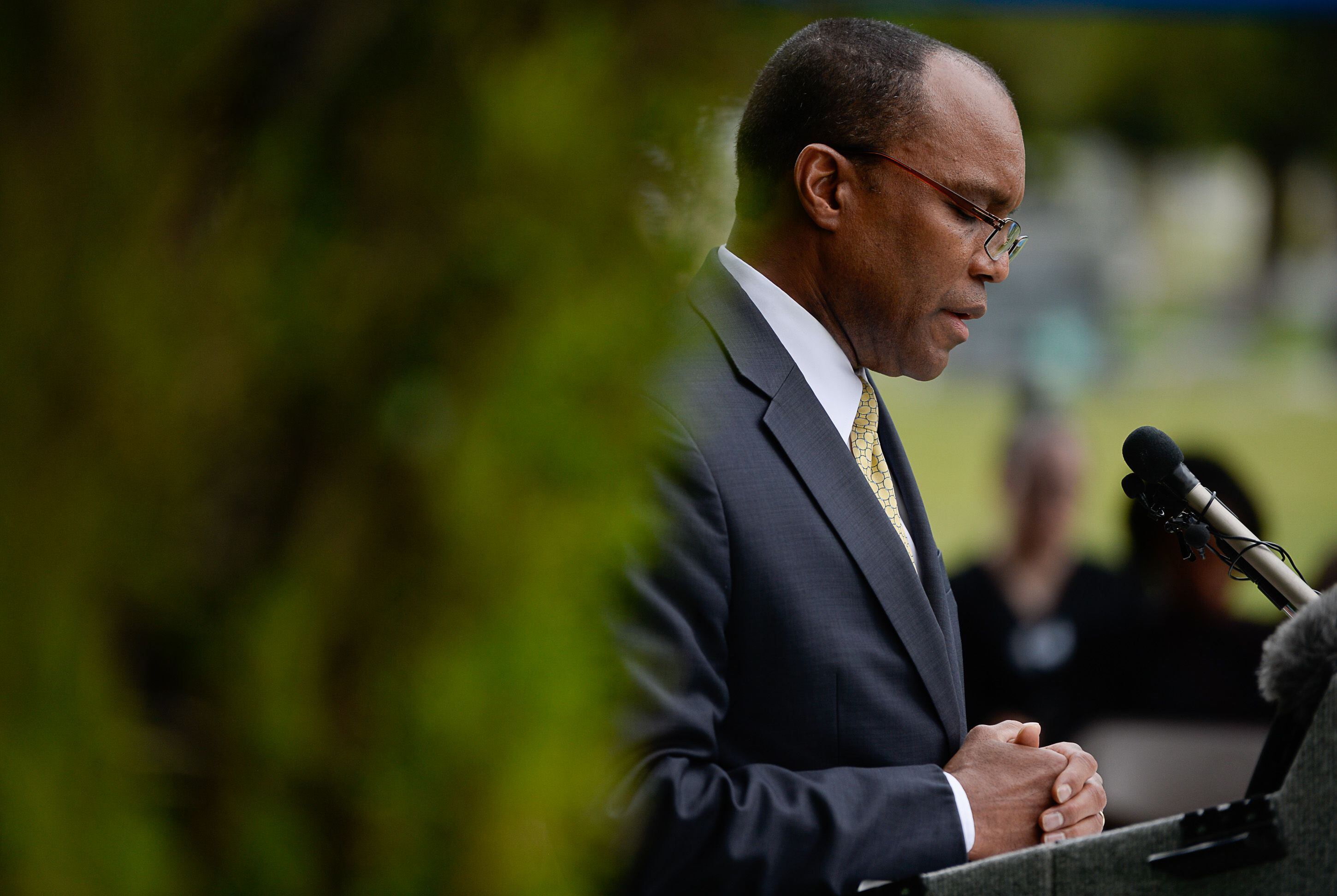 (Francisco Kjolseth | The Salt Lake Tribune) Pastor Marlin Lynch III, performs the closing prayer during the dedication of the first grave marker for Tom, an enslaved Black pioneer who was buried in the Salt Lake City Cemetery in 1862. Smoot, a well-known pioneer and the second mayor of Salt Lake City, eventually acquired Tom, according to 1850 County census records. Tom was baptized in the Sugarhouse Ward by Henry A. Cheever on June 24th, 1854. Tom died from causes listed as Òinflammation of the chestÓ in 1862 at the age of 42 and was buried in the pauper's section of the Salt Lake City Cemetery.