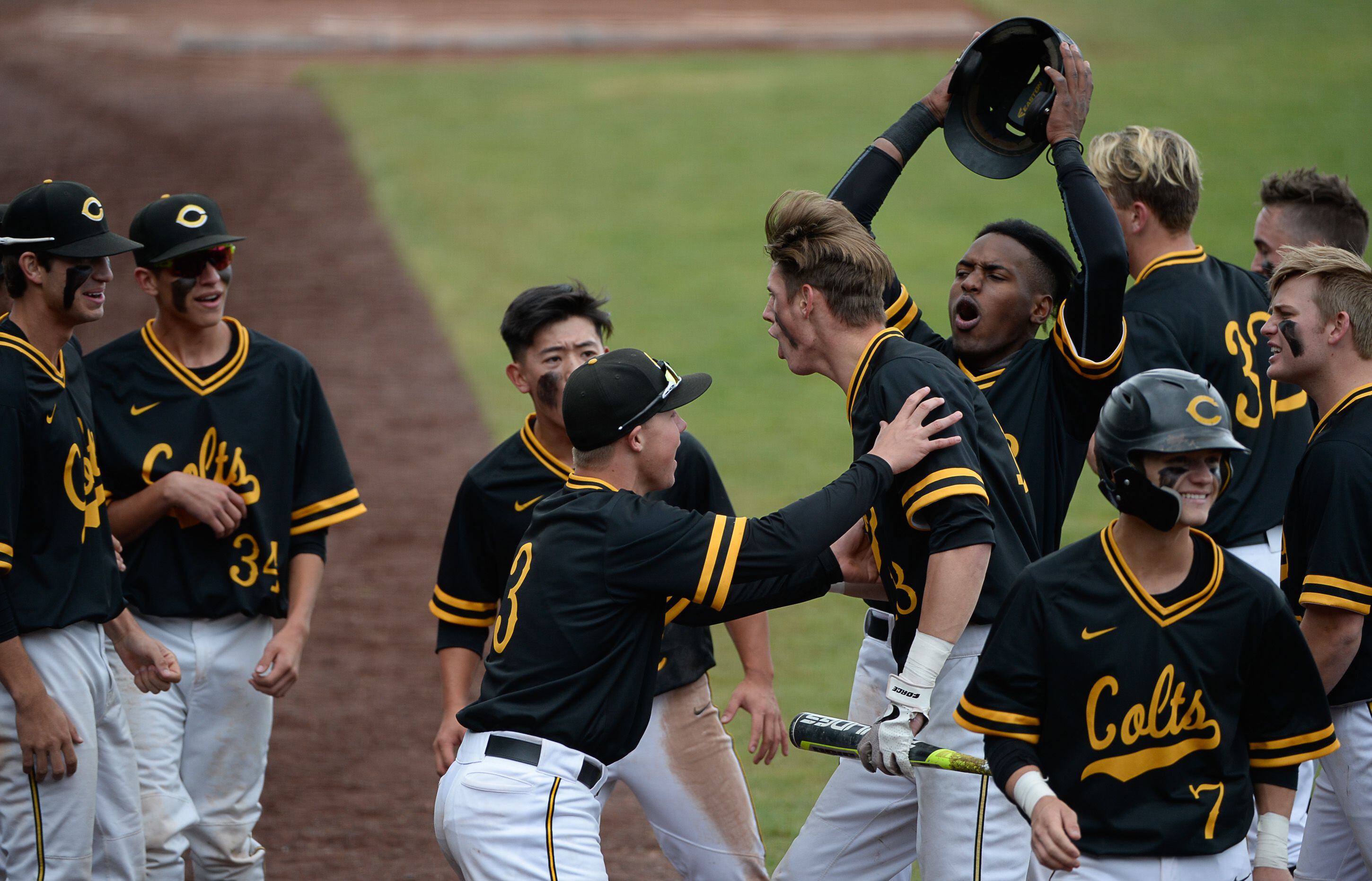 (Francisco Kjolseth | The Salt Lake Tribune) Cottonwood's Dylan Reiser, center, celebrates a run with teammates during the 5A baseball championship game at UCCU Stadium on the UVU campus in Orem, Friday, May 24, 2019.