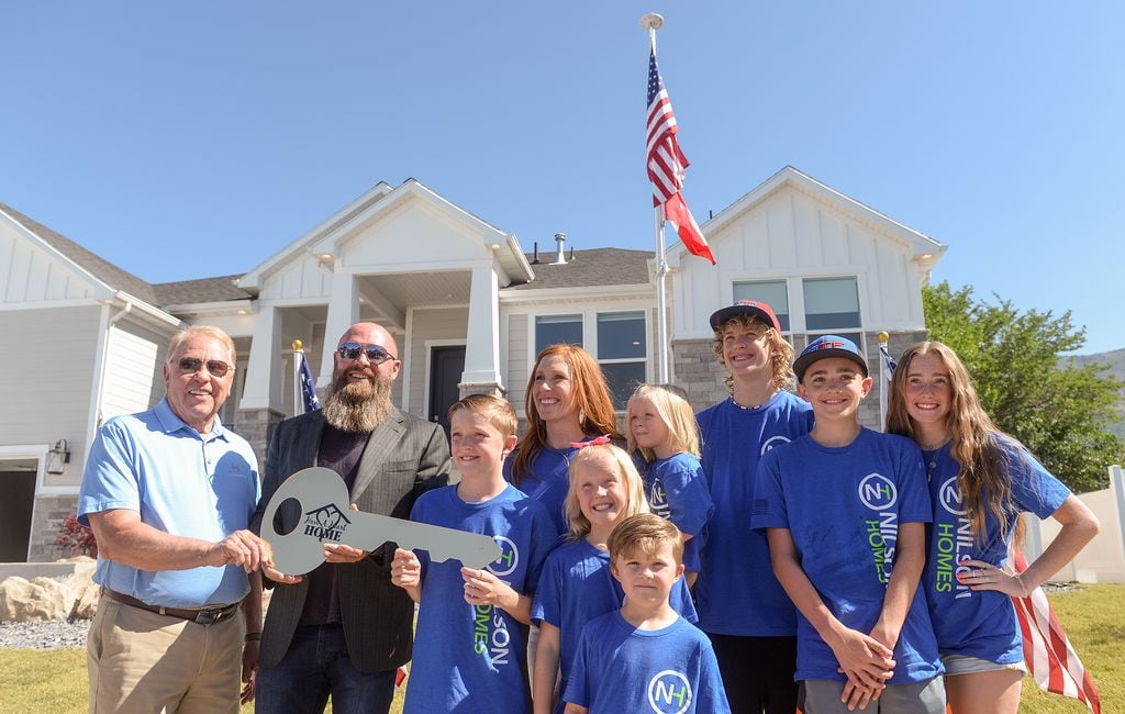 So much more than a house': Widow, kids of North Ogden Mayor Brent Taylor  receive new home