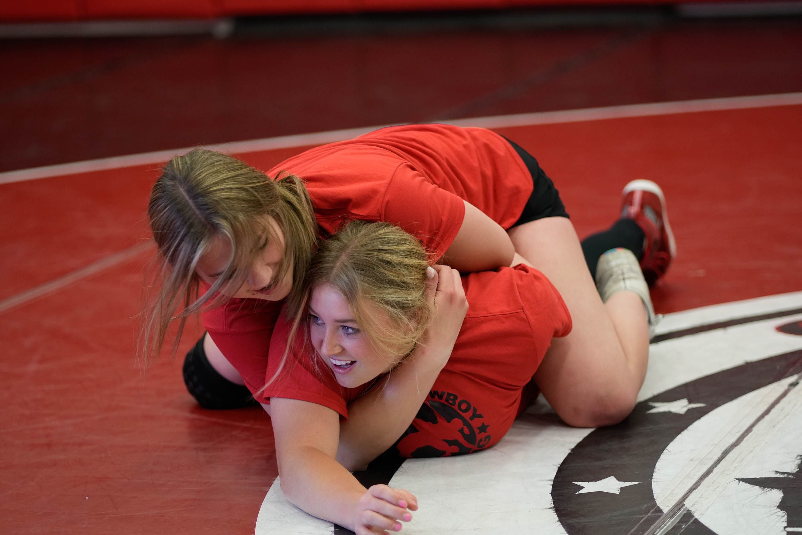 (Francisco Kjolseth | The Salt Lake Tribune) Grantsville High School wrestlers Hailey Broderick, left, and Addison Butler work a number of drills during a recent practice at school on Tuesday, May 9, 2023. Broderick’s background in cheerleading and Butler who plays softball and tennis have seen their physical interests to be a good asset when going to the mat. 