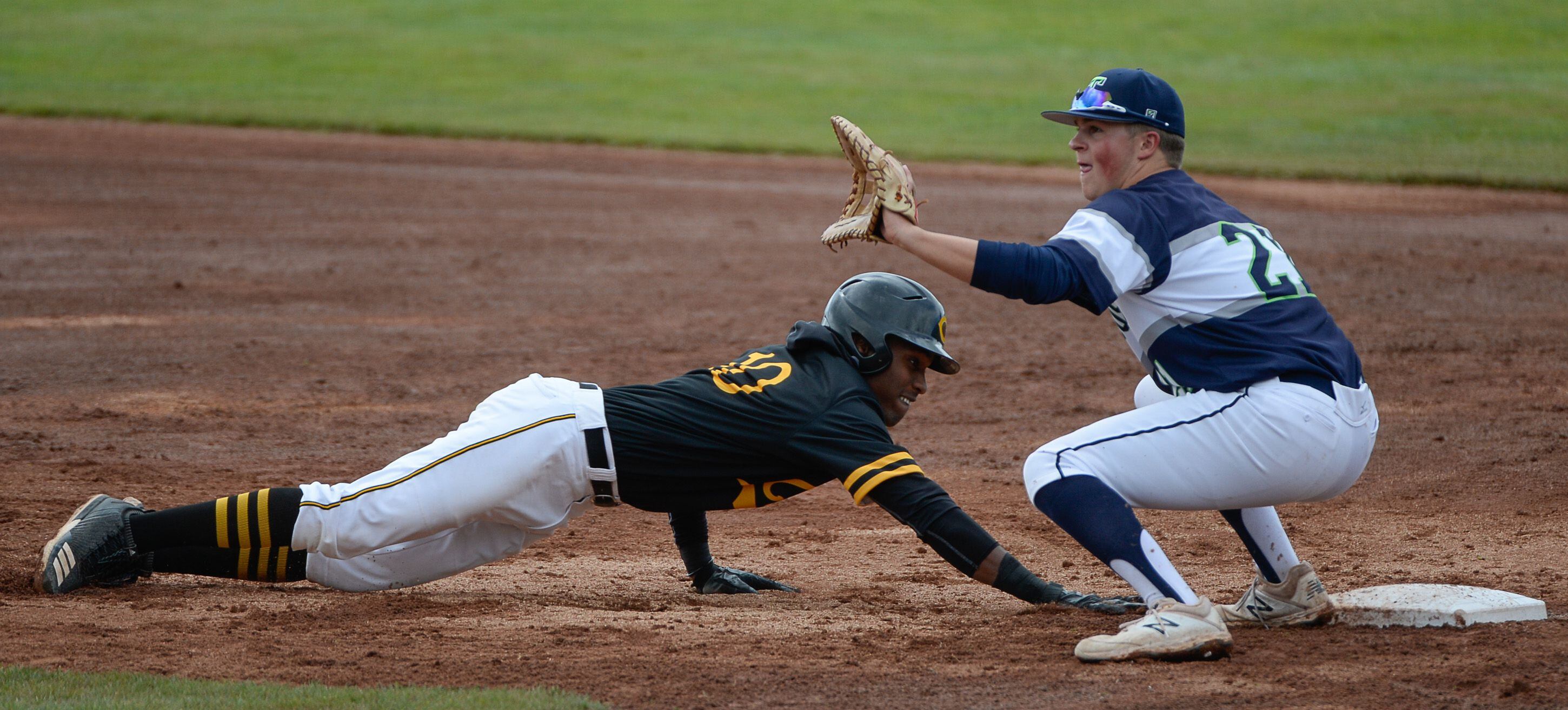 (Francisco Kjolseth | The Salt Lake Tribune) Daniel Gonzales manages to get safely back to first at Paxton Richards stays ready at first during the 5A baseball championship game at UCCU Stadium on the UVU campus in Orem, Friday, May 24, 2019.