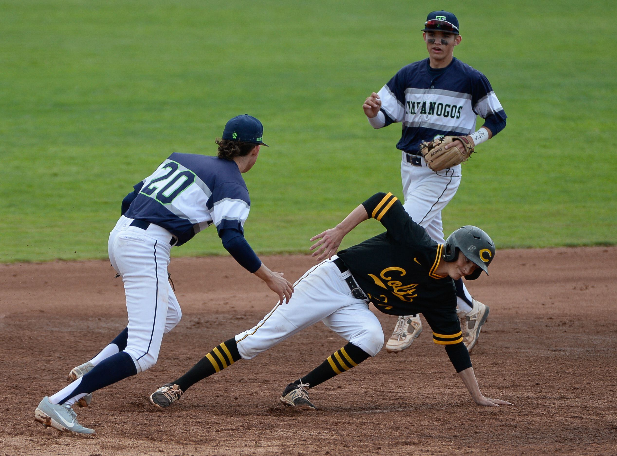 (Francisco Kjolseth | The Salt Lake Tribune) Cottonwood's Brodie Guthrie is caught between bases as Ky Decker of Timpanogos tags him out during the 5A baseball championship game at UCCU Stadium on the UVU campus in Orem, Friday, May 24, 2019.