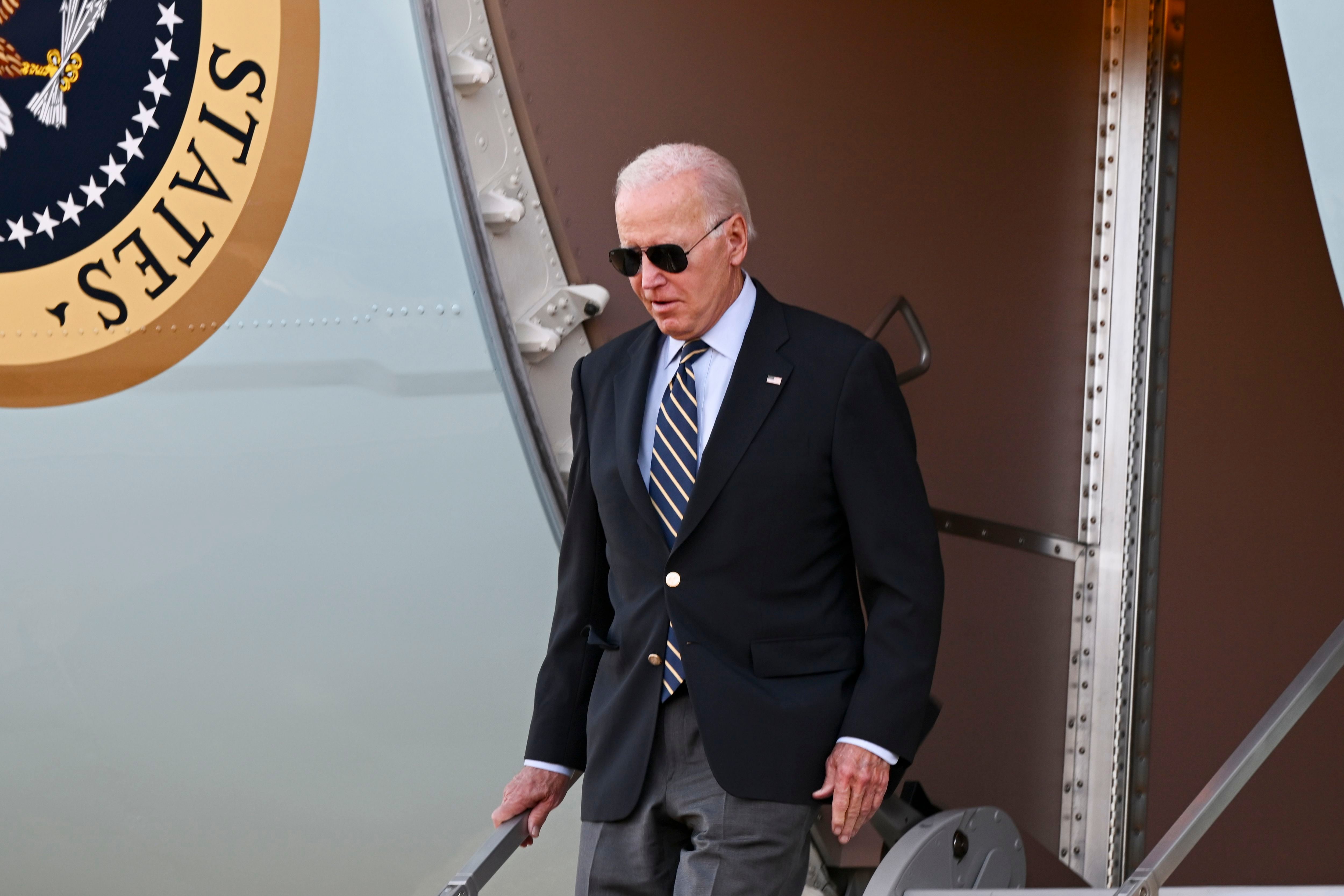 Biden heads west for a policy victory lap, drawing an implicit contrast with  Trump