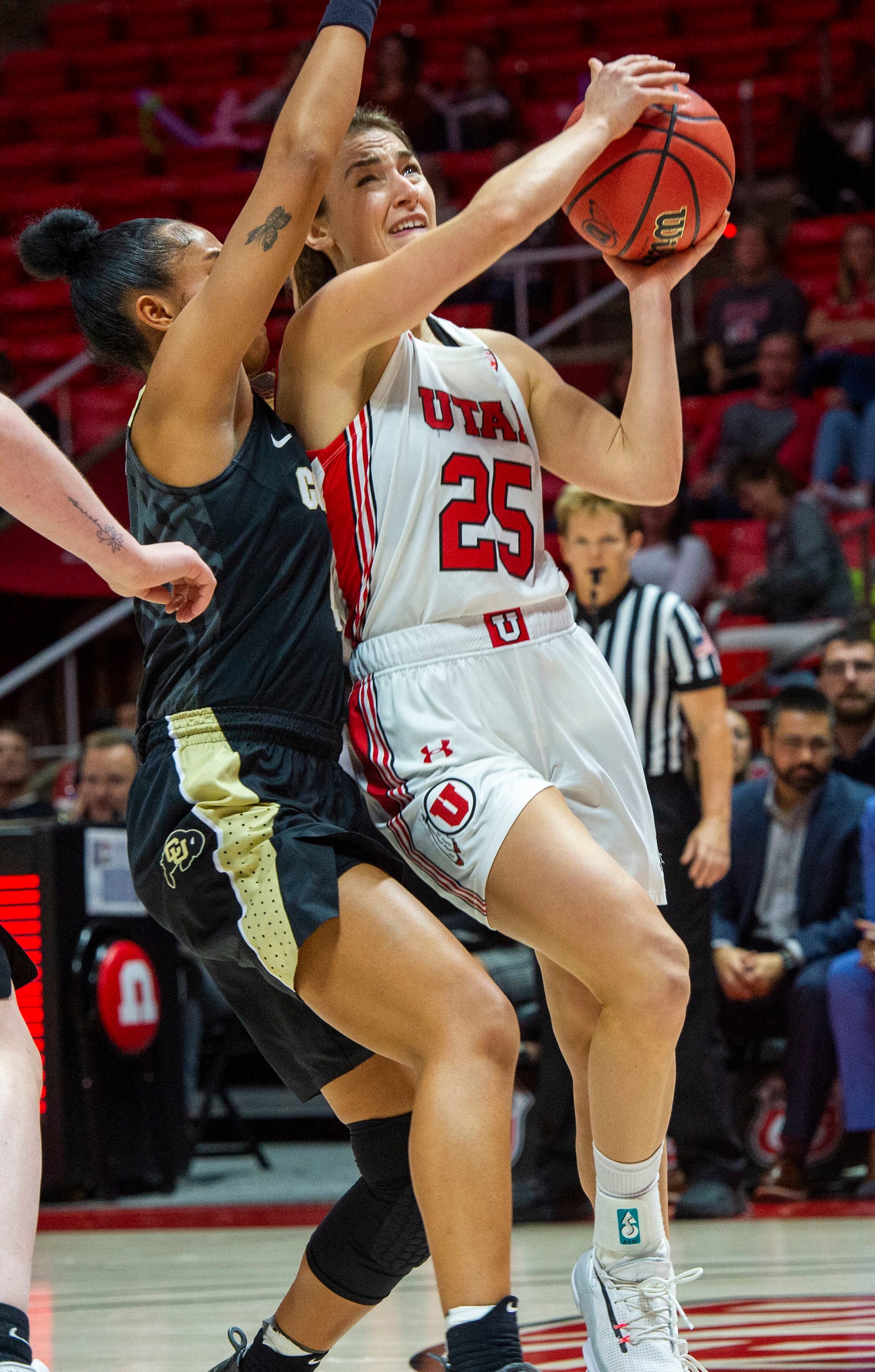 (Rick Egan | The Salt Lake Tribune) Utah Utes guard Julie Brosseau (25) takes the ball do the hoop, as Colorado Buffaloes guard Lesila Finau (4) defends, in PAC-12 basketball action between the Utah Utes and the Colorado Buffaloes, at the Jon M. Huntsman Center, Sunday, Nov. 29, 2019.