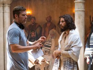 ("The Chosen") Director Dallas Jenkins, left, works with Jonathan Roumie, who plays Jesus, during taping of a scene of Season 3 of "The Chosen." The production has come under fire from some conservatives after a pride flag was seen on the set.