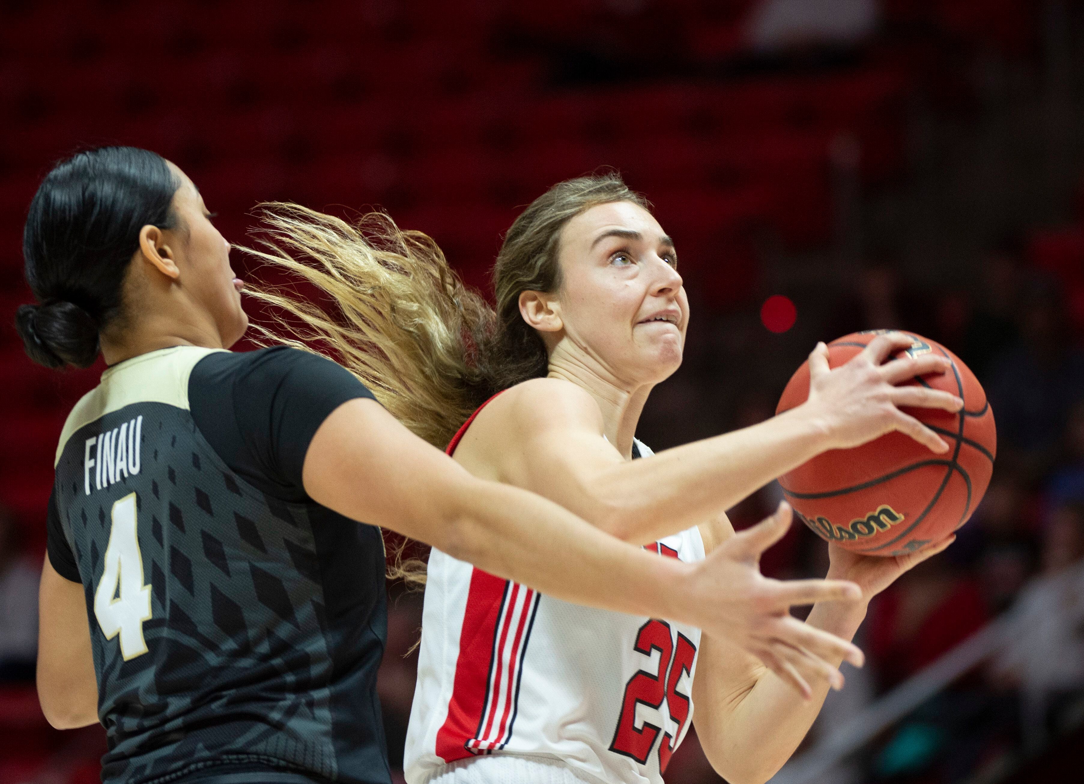 (Rick Egan | The Salt Lake Tribune) Utah Utes guard Julie Brosseau (25) takes the ball do the hoop, as Colorado Buffaloes guard Lesila Finau (4) defends, in PAC-12 basketball action between the Utah Utes and the Colorado Buffaloes, at the Jon M. Huntsman Center, Sunday, Nov. 29, 2019.