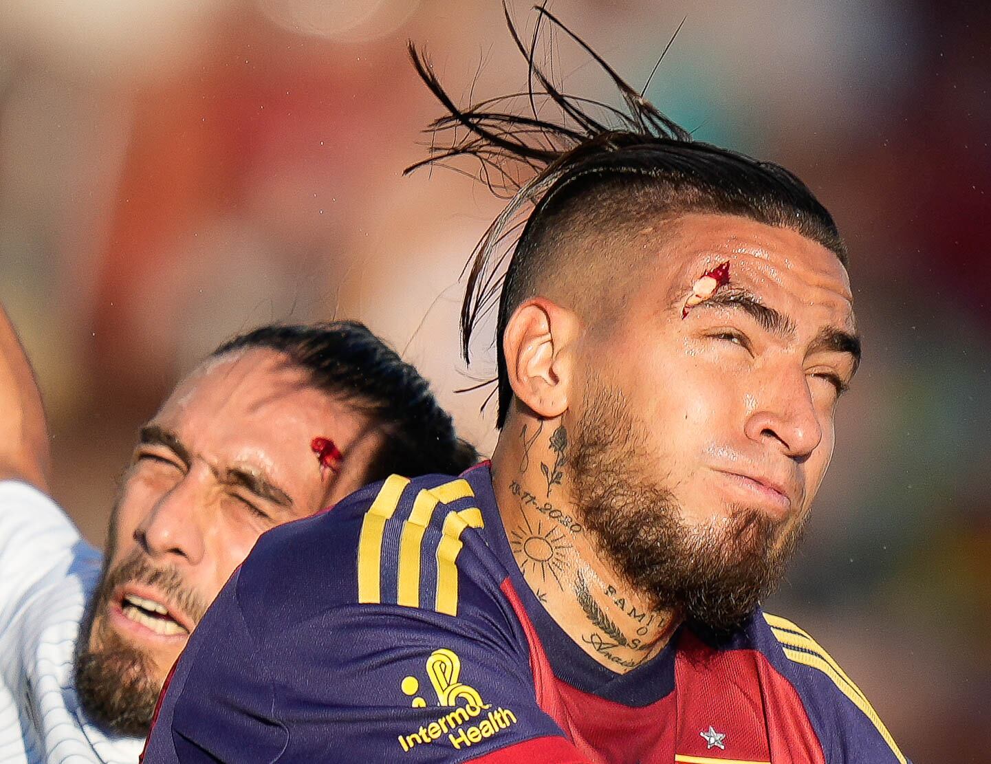 (Francisco Kjolseth | The Salt Lake Tribune) Real Salt Lake forward Chicho Arango (9) splits his brow as he collides with Los Angeles Galaxy defender Martín Cáceres (22) both ending up with bloody head wounds during an MLS soccer match against LA Galaxy on Saturday, June 22, 2024, in Sandy Utah.