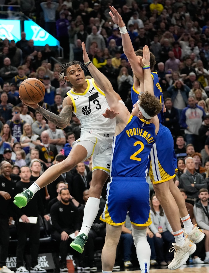 (Francisco Kjolseth  |  The Salt Lake Tribune) Utah Jazz guard Keyonte George (3) looks for an opening past Golden State Warriors guard Brandin Podziemski (2) during an NBA basketball game Thursday, Feb. 15, 2024, in Salt Lake City.