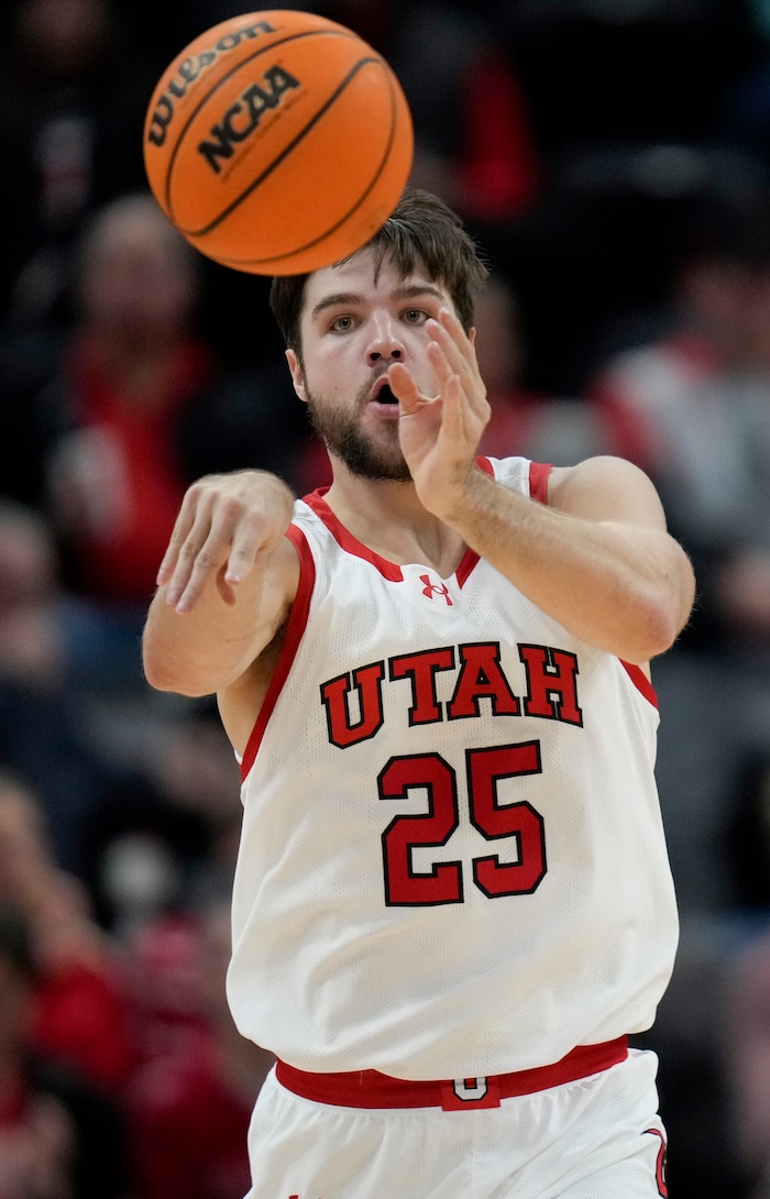 (Bethany Baker  |  The Salt Lake Tribune) Utah Utes guard Rollie Worster (25) passes the ball against the Hawaii Warriors at the Delta Center in Salt Lake City on Thursday, Nov. 30, 2023.
