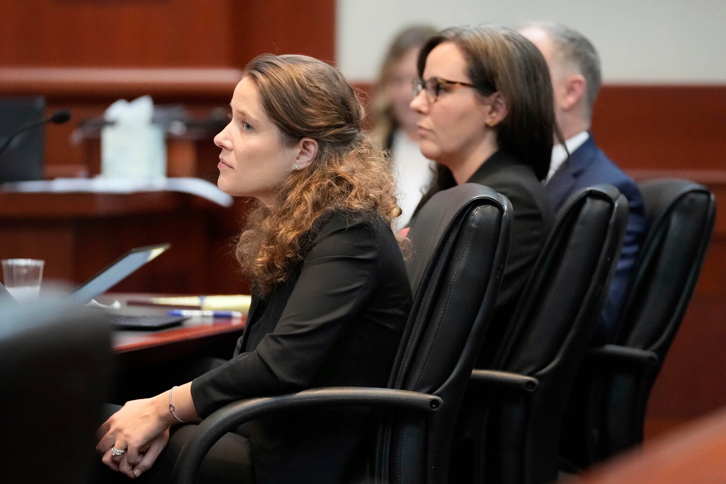 Attorney's Camila Vega with Planned Parenthood, left, and Julie Murray with the ACLU, listens to oral arguments involving Utah's abortion trigger law before the Utah Supreme Court, Tuesday, Aug. 8, 2023, in Salt Lake City. The state Supreme Court is weighing a lower court's decision to put a law banning most abortions on hold more than a year ago. (Francisco Kjolseth/The Salt Lake Tribune via AP, Pool)