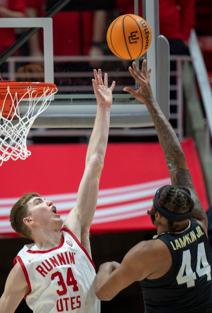 (Rick Egan | The Salt Lake Tribune) Colorado Buffaloes center Eddie Lampkin Jr. (44) shoots as Utah Utes center Lawson Lovering (34) defends, in PAC-12 basketball action between the Utah Utes and the Colorado Buffaloes a the Jon M. Huntsman Center, on Saturday, Feb. 3, 2024.
