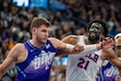 Utah Jazz center Walker Kessler (24) jockeys for position with Philadelphia 76ers center Joel Embiid (21) during the first half of an NBA basketball game Saturday, Dec. 28, 2024, in Salt Lake City. (AP Photo/Rick Egan)