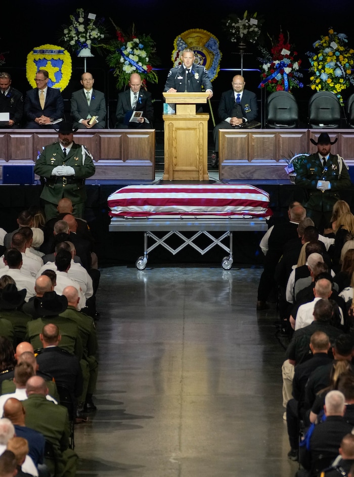 (Francisco Kjolseth  |  The Salt Lake Tribune) Santaquin police Lt. Mike Wall speaks during funeral services for Santaquin police Sgt. Bill Hooser at the UCCU Center at Utah Valley University on Monday, May 13, 2024.